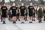 Members of the West Virginia National Guard stand at attention prior to starting a physical training session with the Peruvian Army March 27, 2019, in Lima, Perú. Members of the West Virginia National Guard provided a week-long training on non-commissioned officer (NCO) development planning and implementation for the Peruvian Army’s senior NCOs. (U.S. Air National Guard photo by Maj. Holli Nelson)