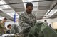 A military member packing a duffle bag