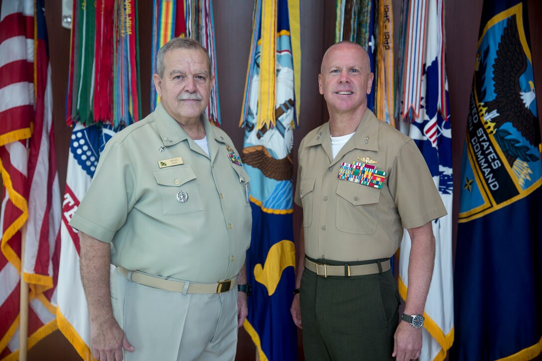 Maj. Gen. Michael F. Fahey III, right, shakes hands with Rear Adm. Nélio De Almeida at U.S. Marine Corps Forces, South, Feb. 25, 2019.