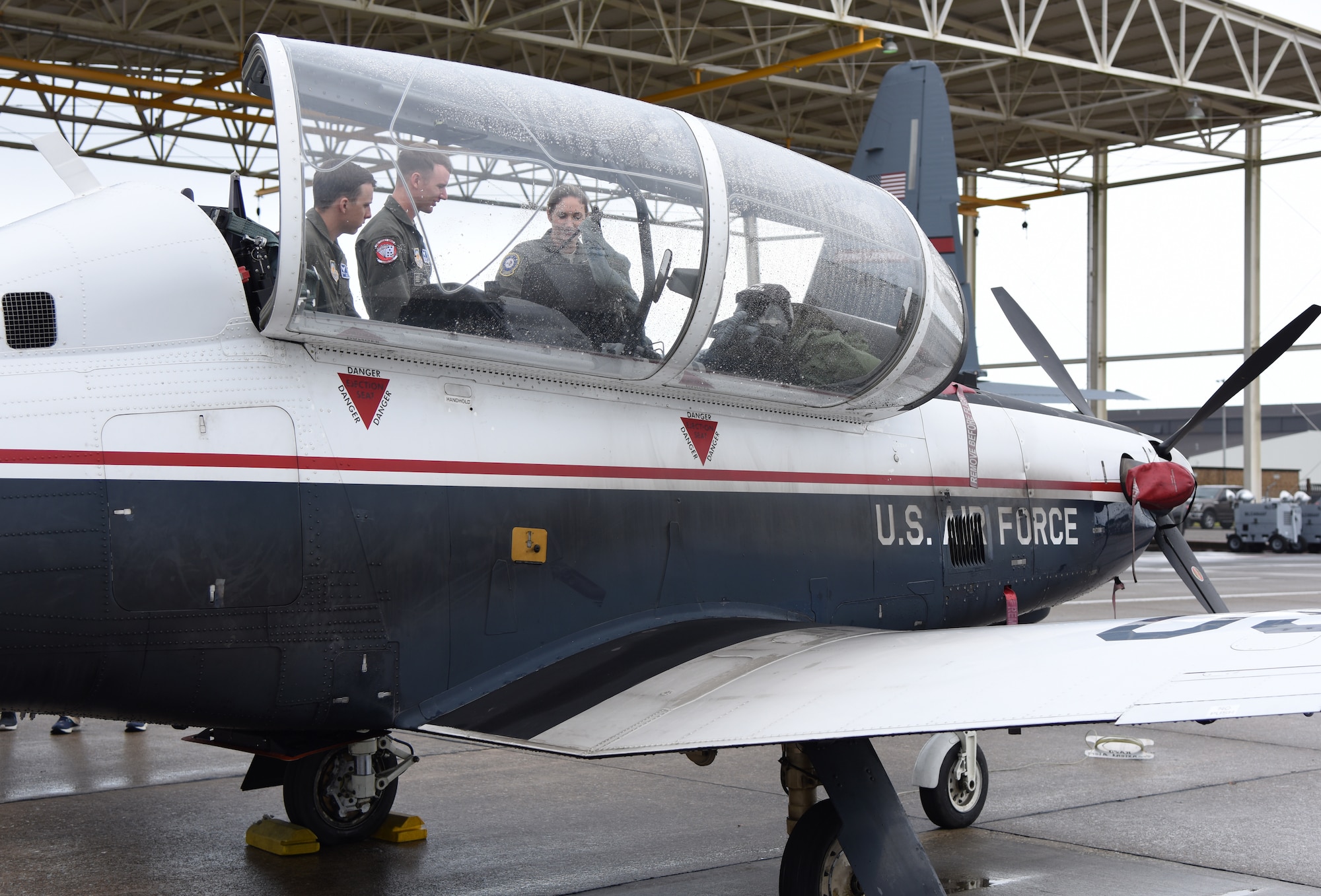 U.S. Air Force Maj. Jen Prouty, 37th Flying Training Squadron wing safety chief, Columbus Air Force Base, Mississippi, shows the cockpit of a T-6 Texan II static display to Christopher Ferry and Charles Jones, University of South Alabama Air Force ROTC cadets, during the fifth annual Pathways to Blue on Keesler Air Force Base, Mississippi, April 5, 2019. Pathways to Blue is a diversity outreach event hosted by Second Air Force with the support of the 81st Training Wing and the 403rd Wing. More than 250 cadets from 12 different colleges and universities were provided hands-on demonstrations of various career fields. (U.S. Air Force photo by Kemberly Groue)