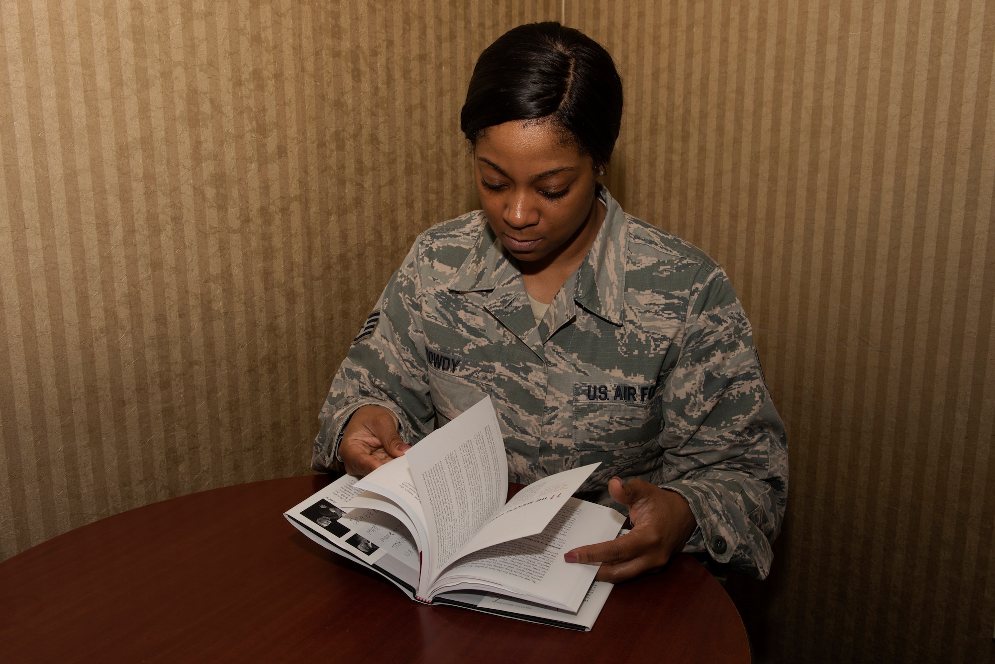 U.S. Air Force Staff Sgt. Lashauna Dowdy, 60th Force Support Squadron front desk clerk, reads “The One Thing: The Surprisingly Simple Truth Behind Extraordinary Results” by Gary Keller, inside the Westwind Inn April 1, 2019 at Travis Air Force Base, California. The book was the second book featured in the Professional Literature Program, which was implemented at Travis in February 2019. (U.S. Air Force photo by Tech. Sgt. James Hodgman)