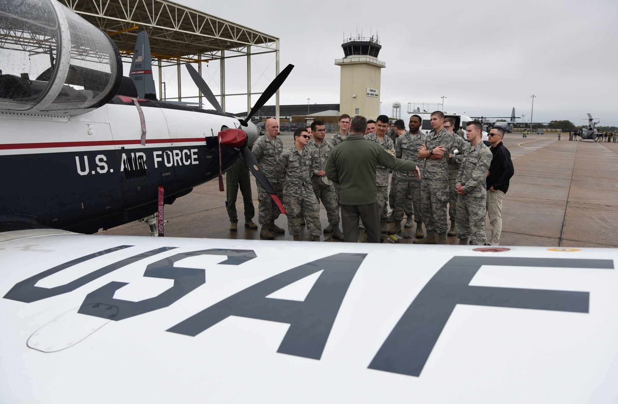 U.S. Air Force Maj. Thomas Martin, 37th Flying Training Squadron instructor pilot, Columbus Air Force Base, Mississippi, briefs Air Force ROTC cadets on a T-6 Texan II static display during the fifth annual Pathways to Blue on Keesler Air Force Base, Mississippi, April 5, 2019. Pathways to Blue is a diversity outreach event hosted by Second Air Force with the support of the 81st Training Wing and the 403rd Wing. More than 250 cadets from 12 different colleges and universities were provided hands-on demonstrations of various career fields. (U.S. Air Force photo by Kemberly Groue)