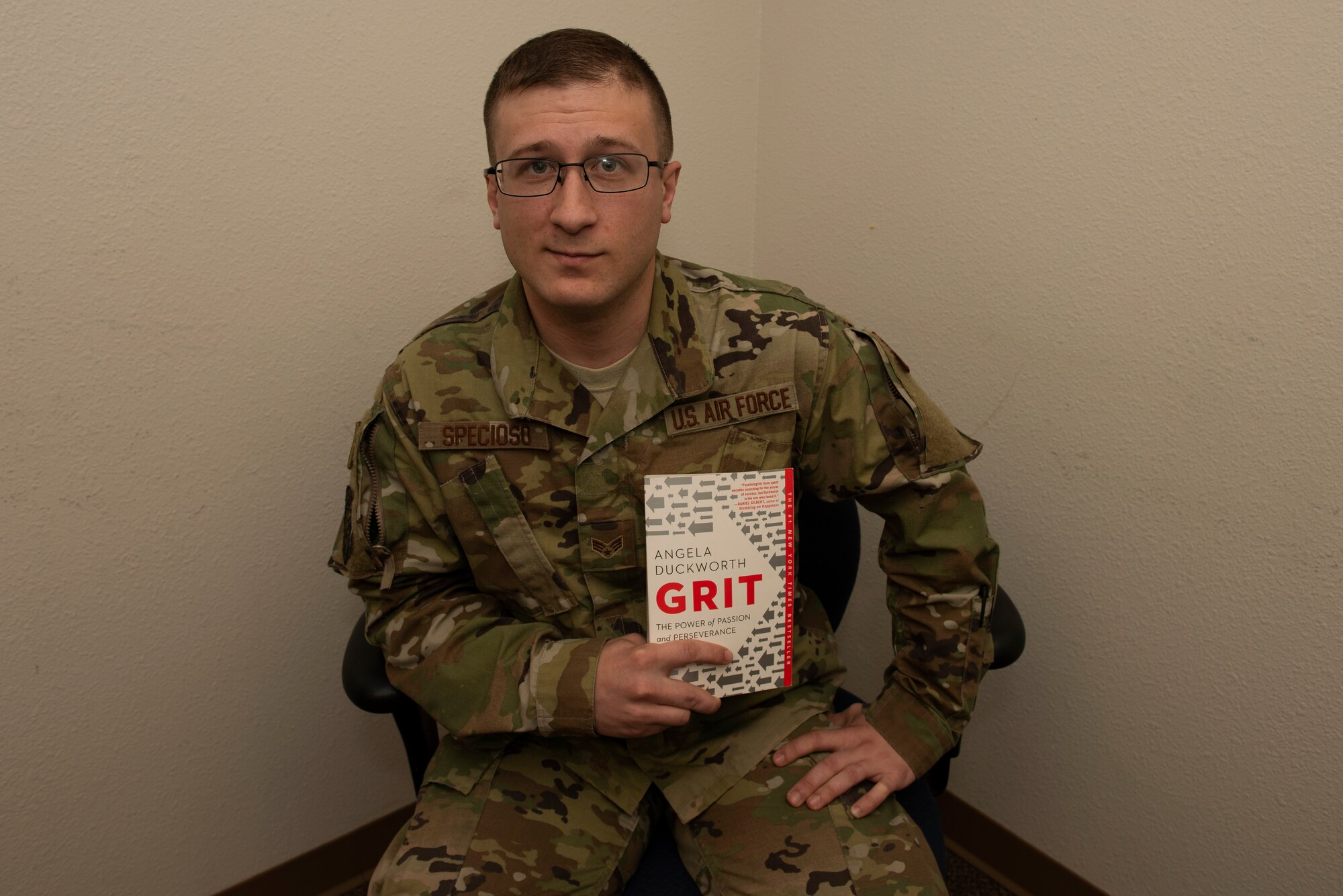 U.S. Air Force Senior Airman Michael Specioso, 60th Security Forces Squadron acting NCO in charge of vehicle operations, holds the book “Grit: The Power of Passion and Perseverance” by Angela Duckworth March 7, 2019 at Travis Air Force Base, California. The book was the first in the newly implemented professional literature program at Travis where participants read one book a month and provide feedback on what they learned during a monthly discussion group. (U.S. Air Force photo by Tech. Sgt. James Hodgman)