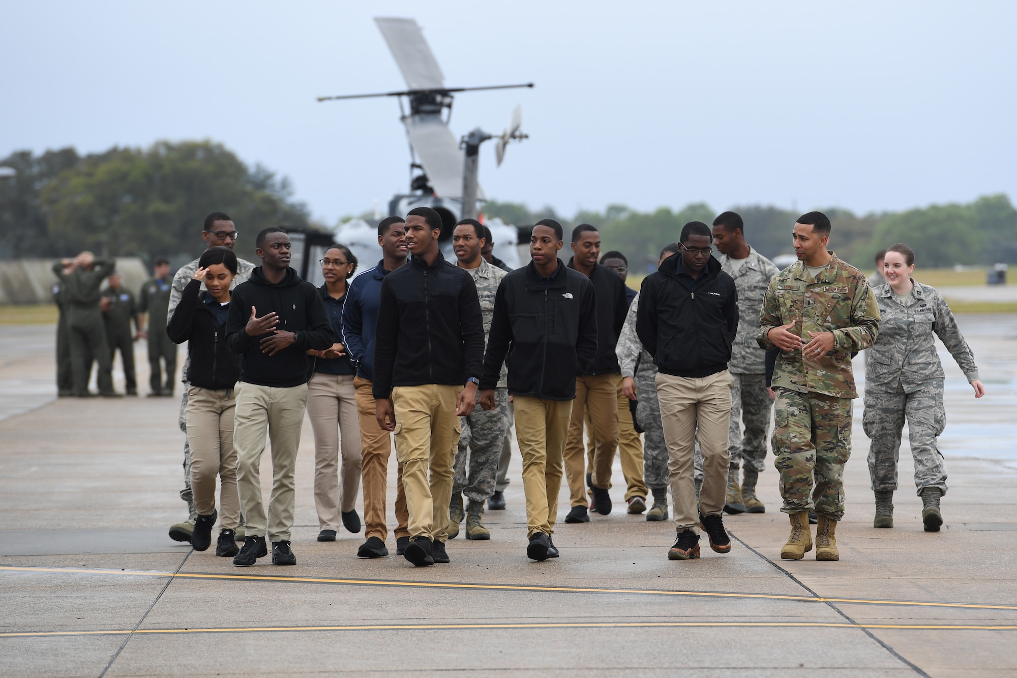 Air Force ROTC cadets walk across the flight line during the fifth annual Pathways to Blue on Keesler Air Force Base, Mississippi, April 5, 2019. Pathways to Blue is a diversity outreach event hosted by Second Air Force with the support of the 81st Training Wing and the 403rd Wing. More than 250 cadets from 12 different colleges and universities were provided hands-on demonstrations of various career fields. (U.S. Air Force photo by Kemberly Groue)