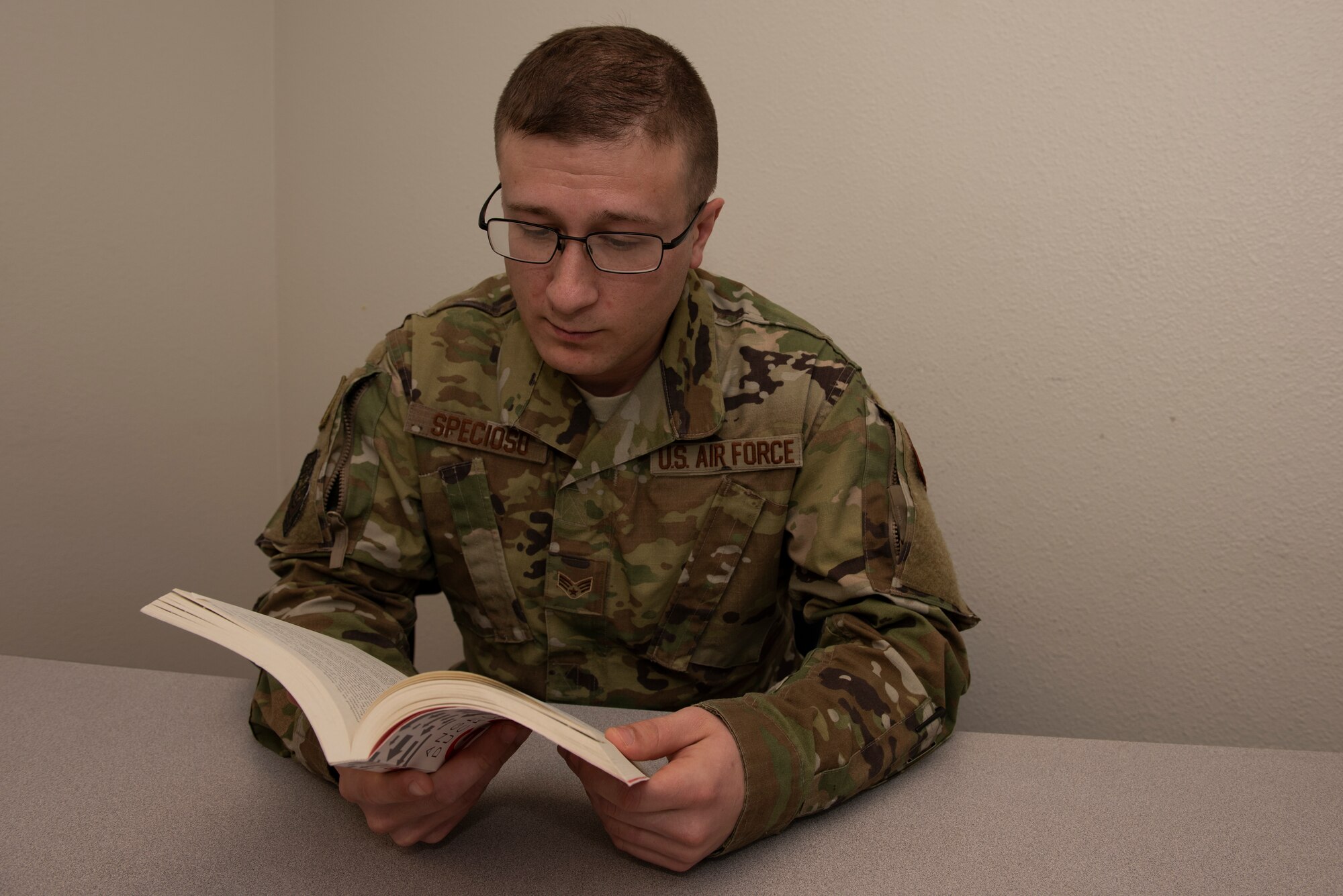 U.S. Air Force Senior Airman Michael Specioso, 60th Security Forces Squadron acting NCO in charge of vehicle operations, reads “Grit: The Power of Passion and Perseverance” by Angela Duckworth March 7, 2019, at Travis Air Force Base, California. The book was the first in the newly implemented professional literature program at Travis where participants read one book a month and provide feedback on what they learned during a monthly discussion group. (U.S. Air Force photo by Tech. Sgt. James Hodgman)