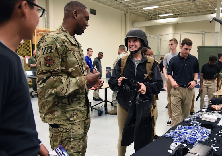 U.S Air Force Tech. Sgt. Cornelius Bostic, 330th Special Warfare Recruiting Squadron recruiter, briefs Claire Stewart, University of Houston Air Force ROTC cadet, on equipment worn by special operations members during the fifth annual Pathways to Blue on Keesler Air Force Base, Mississippi, April 5, 2019. Pathways to Blue is a diversity outreach event hosted by Second Air Force with the support of the 81st Training Wing and the 403rd Wing. More than 250 cadets from 12 different colleges and universities were provided hands-on demonstrations of various career fields. (U.S. Air Force photo by Kemberly Groue)