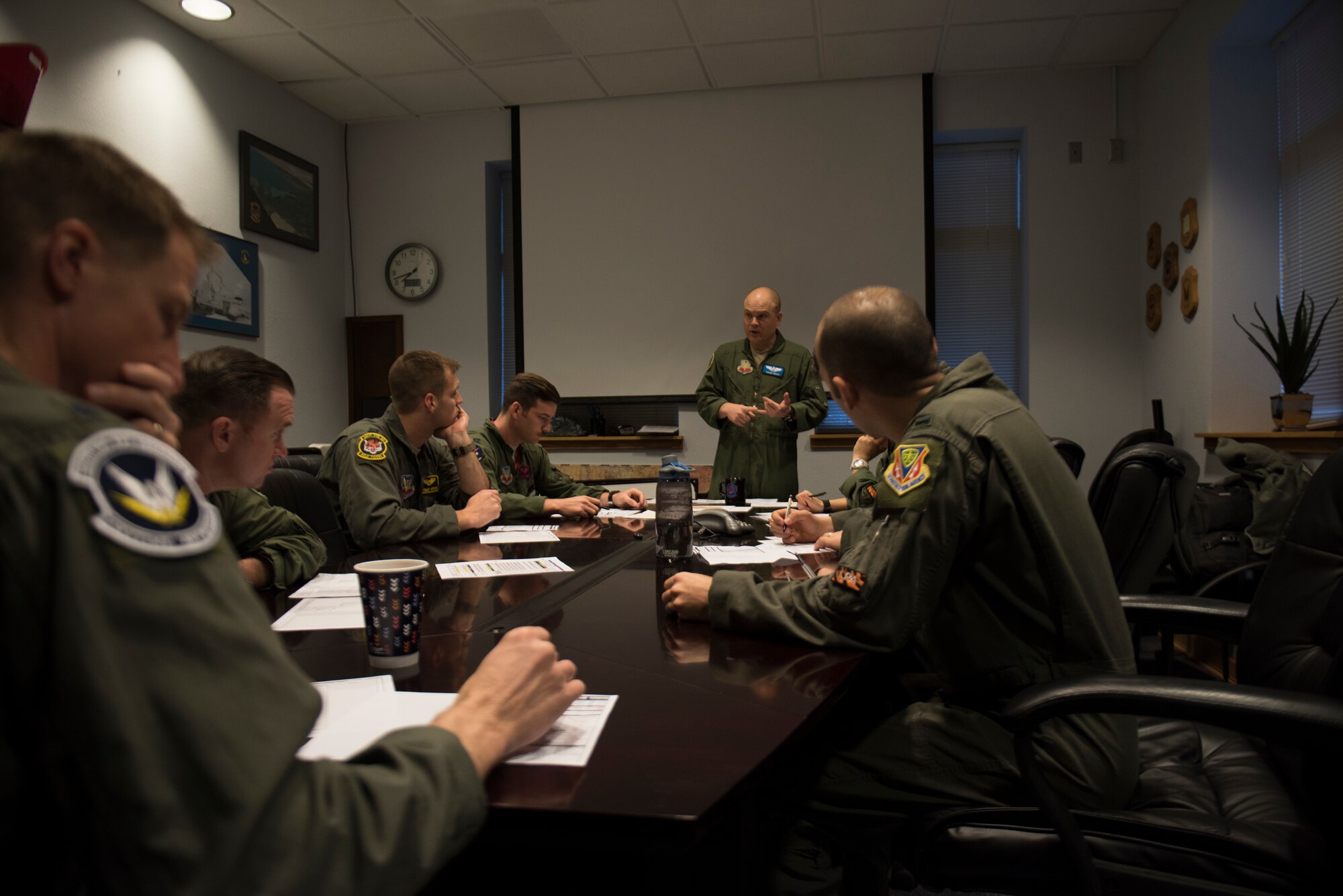 Image of Lt. Col. Thomas Bean, 366th Fighter Wing Inspector General and F-15E instructor pilot, briefs pilots before a flight April 3, 2019, at Mountain Home Air Force Base, Idaho. The pilots are participants of Gunfighter Flag, a quarterly exercise designed to strengthen and combine mission capabilities. (U.S. Air Force photo by Senior Airman Alaysia Berry)