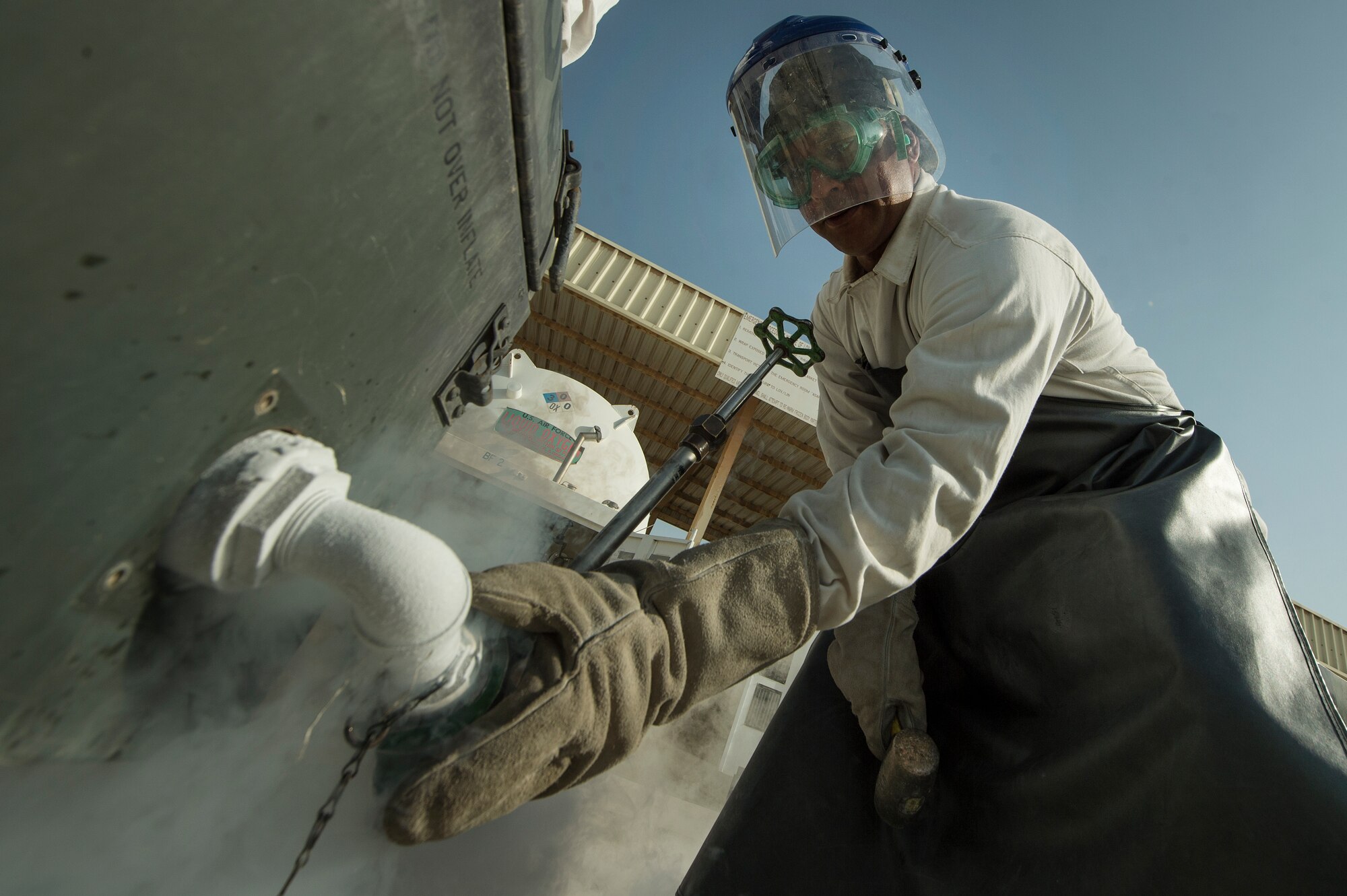 Staff Sgt. Shakir Alikhan, 379th Expeditionary Logistics Readiness Squadron cryogenics section fuels journeyman, prepares to retrieve liquid oxygen for inspection at Al Udeid Air Base, Qatar, April 4, 2019. The cryogenics team here ensures aircrew members across U.S. Air Forces Central Command are equipped with liquid oxygen and nitrogen, supporting flying missions across the region. (U.S. Air Force photo by Tech. Sgt. Christopher Hubenthal)