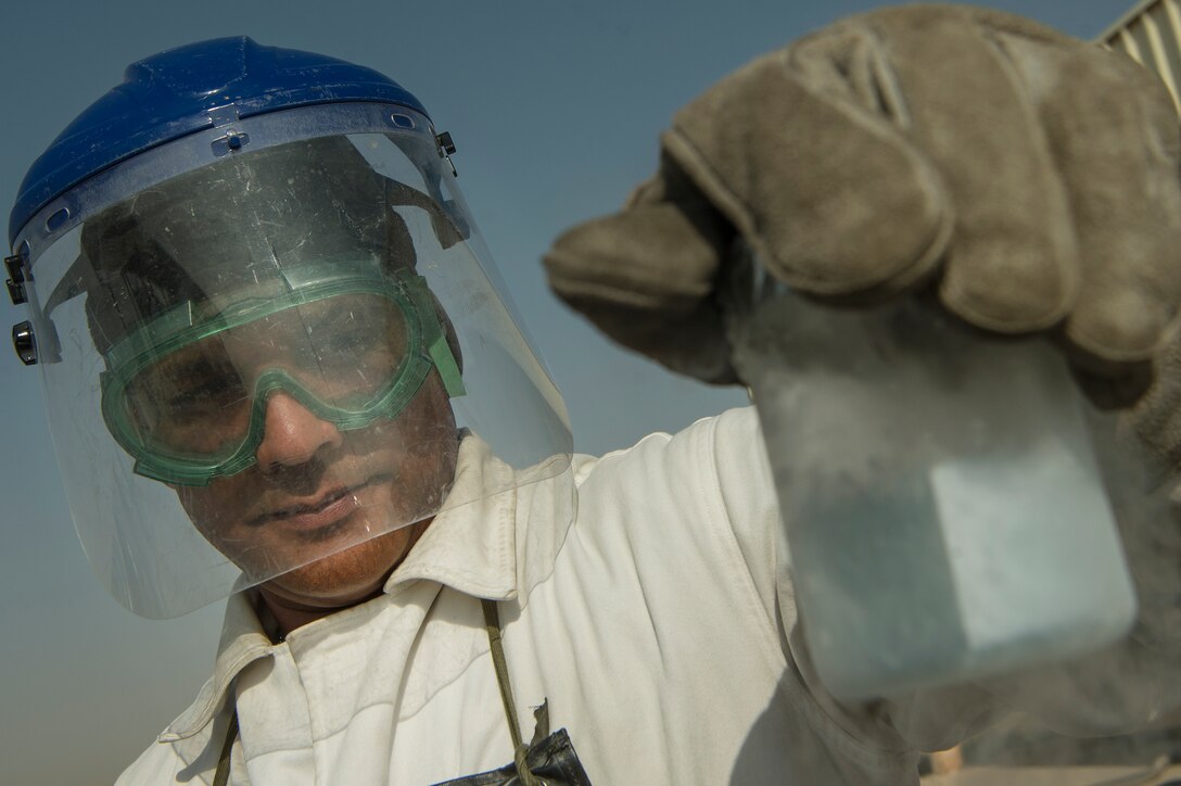 Staff Sgt. Shakir Alikhan, 379th Expeditionary Logistics Readiness Squadron cryogenics section fuels journeyman, inspects liquid oxygen at Al Udeid Air Base, April 4, 2019. The cryogenics team here ensures aircrew members across U.S. Air Forces Central Command are equipped with liquid oxygen and nitrogen, supporting flying missions across the region. (U.S. Air Force photo by Tech. Sgt. Christopher Hubenthal)