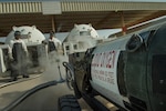 Staff Sgt. Shakir Alikhan, left, 379th Expeditionary Logistics Readiness Squadron (ELRS) cryogenics section fuels journeyman, and Tech. Sgt. Nathan Retallack, right, 379th ELRS fuels cryogenic supervisor, prepare to retrieve and inspect liquid oxygen at Al Udeid Air Base, Qatar, April 4, 2019. The cryogenics team ensures aircrew members across U.S. Central Command are equipped with liquid oxygen and nitrogen, supporting flying missions across the region. (U.S. Air Force photo by Tech. Sgt. Christopher Hubenthal)