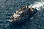 SANTA RITA, Guam (April 4, 2019) A Mark VI patrol boat from CRS-2 Det. Guam, assigned to Coastal Riverine Group 1, Det. Guam, transits Apra Harbor, prior to conducting a first-time proof of concept lift operation with Navy Cargo Handling Battalion (NCHB) 1, Det. Guam. CRS-2, Det. Guam, assigned to Costal Riverine Group 1, Det. Guam, is capable of conducting maritime security operations across the full spectrum of naval, joint and combined operations. Further, it provides additional capabilities of port security, embarked security, and theater security cooperation around the U.S. 7th Fleet area of operations. (U.S. Navy photo by Mass Communication Specialist 1st Class John Philip Wagner, Jr.)