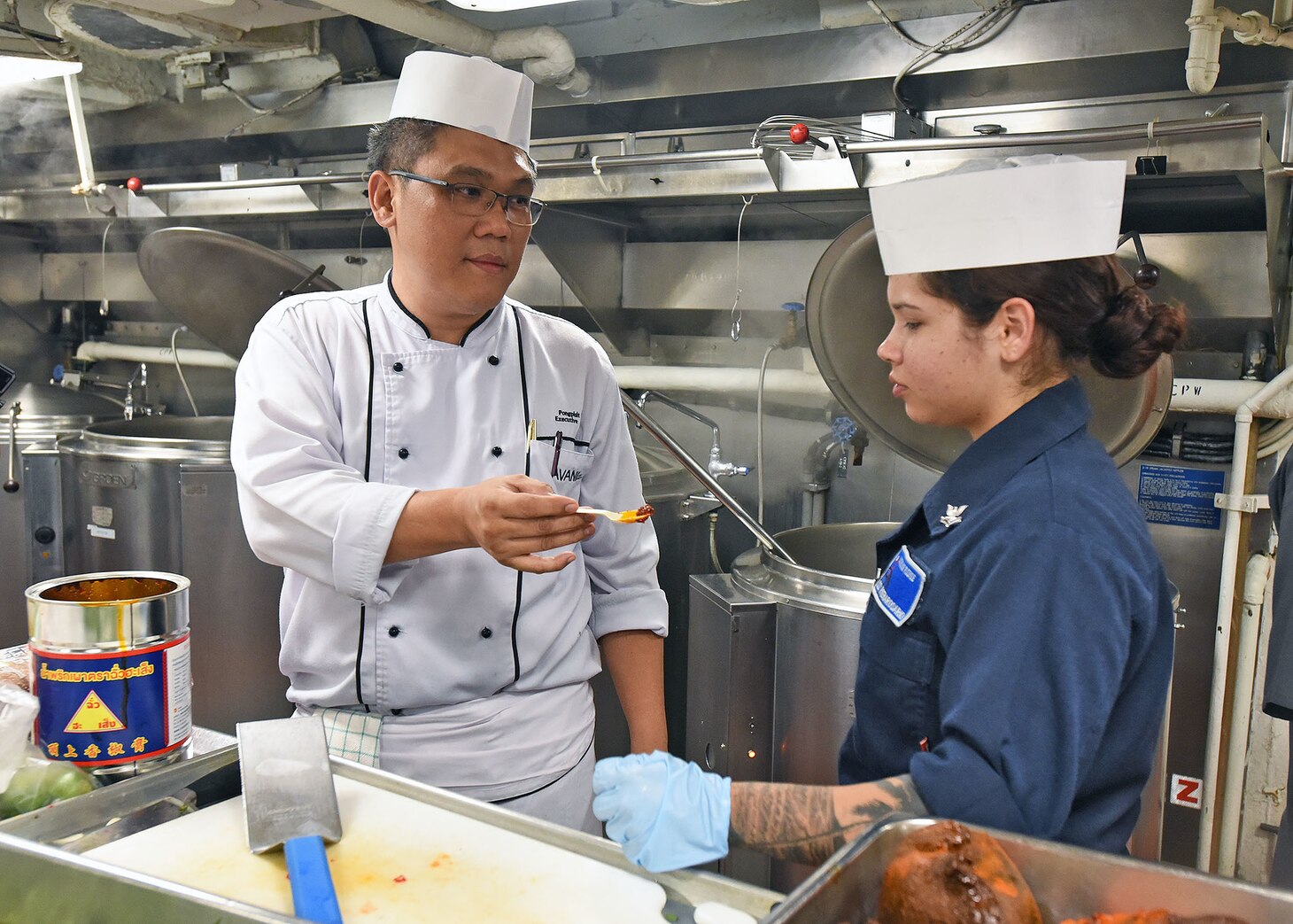 LAEM CHABANG, Thailand (April 6, 2019) - Culinary Specialist 2nd Class Lizmarie Riverarosario, from Luquillo, P.R., receives a sample taste of Thai chili paste from Avani Hotel Pattaya Executive Chef Pangpisit Ungsuchaikij during a traditional Thai cooking event aboard U.S. 7th Fleet Flagship USS Blue Ridge (LCC 19). Blue Ridge is the oldest operational ship in the Navy and, as 7th Fleet command ship, actively works to foster relationships with allies and partners in the Indo-Pacific Region.
