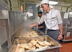 LAEM CHABANG, Thailand (April 6, 2019) - Culinary Specialist 3rd Class Jerico Gonzales, from Glendale, Calif., cooks chicken with Avani Hotel Pattya soux-chef Watchara Plangsorn during a traditional Thai cooking event aboard U.S. 7th Fleet Flagship USS Blue Ridge (LCC 19). Blue Ridge is the oldest operational ship in the Navy and, as 7th Fleet command ship, actively works to foster relationships with allies and partners in the Indo-Pacific Region.