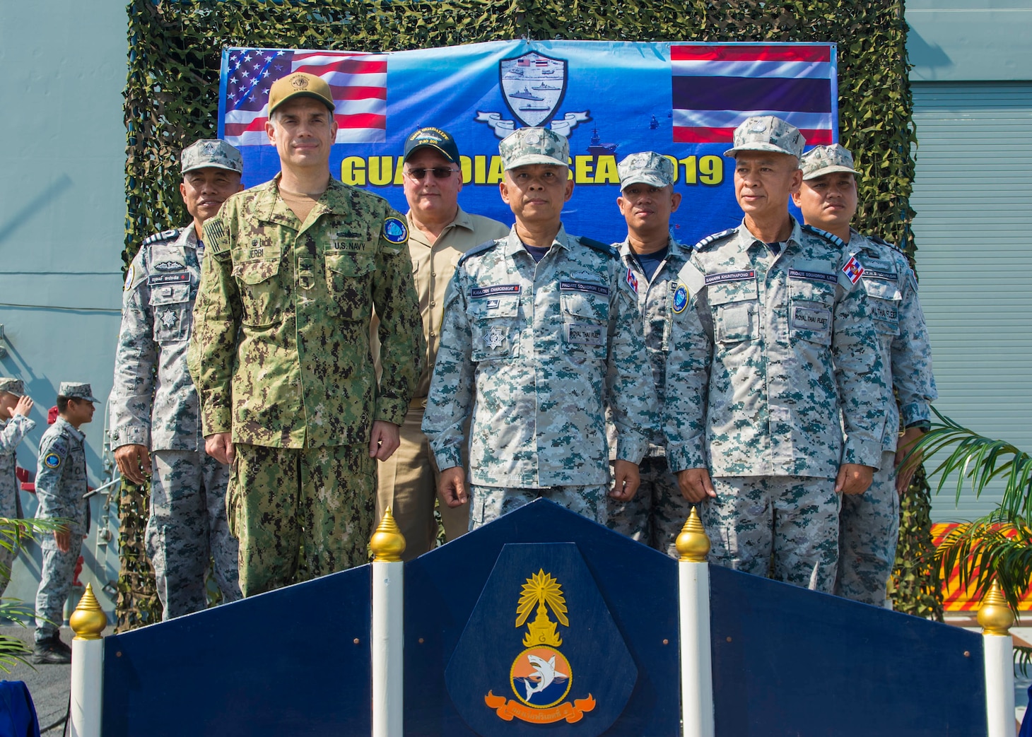 PHUKET, THAILAND (April 7, 2019) - U.S. and Royal Thai Navy leaders stand together during the opening ceremony for Guardian Sea 2019 on the flight deck of RTN frigate HTMS Bhumibol Adulyadej (FFG 471). Guardian Sea is a premier exercise that demonstrates both navies commitment to ensuring that they are ready to counter any threats together.