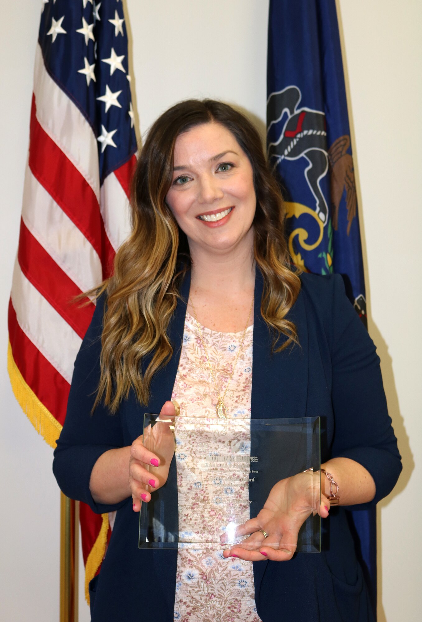 Renee Kotch, Family Readiness volunteer with the 193rd Air Operations Group, is awarded the title of Region 3 Volunteer of the Year in a ceremony April 6, 2019, at the AOG in State College, Pennsylvania. Kotch earned the title for her efforts in providing support and resources to the families of the AOG. “There is so much pride within this volunteer community. My advice to servicemembers: Don’t assume your spouse doesn’t want to be involved. Let us take the same passion, pride and patriotism we all share in our hearts and allow us - the family members - to serve, too,” said Kotch. (U.S. Air National Guard photo by Tech. Sgt. Denise Mckee)