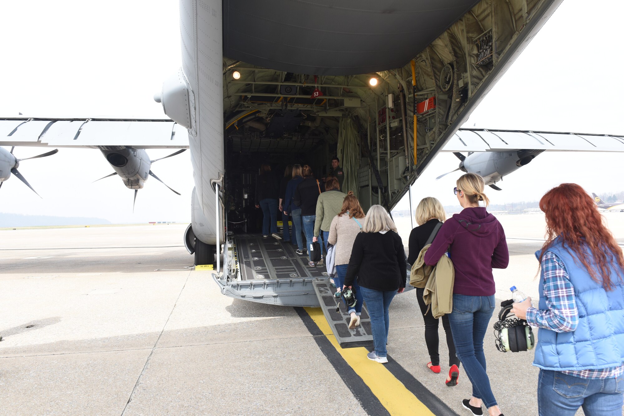 Military spouses affiliated with the 193rd Special Operations Wing, Middletown, Pennsylvania, participate in a spouse orientation flight aboard an EC-130J Super J aircraft April 7, 2018. Spouse orientation flights are conducted for military spouses to familiarize them with the unit aircraft and mission to enhance their understanding of the military member’s role and contribution to the Air Force mission. (U.S. Air National Guard photo by Staff Sgt. Julia Sorber/Released)