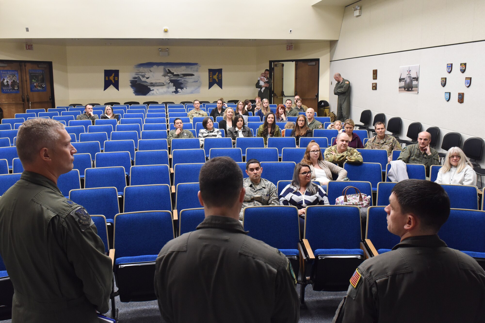 Military spouses affiliated with the 193rd Special Operations Wing, Middletown, Pennsylvania, receive a briefing prior to participating in a spouse orientation flight aboard an EC-130J Super J aircraft April 7, 2019. Spouse orientation flights are conducted for military spouses to familiarize them with the unit aircraft and mission to enhance their understanding of the military member’s role and contribution to the Air Force mission. (U.S. Air National Guard photo by Staff Sgt. Julia Sorber/Released)