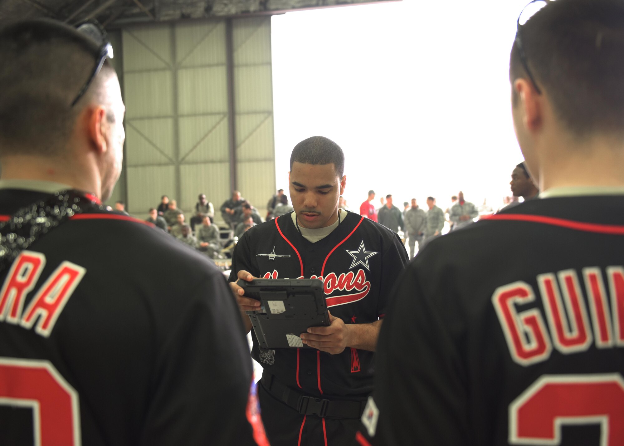 U.S. Air Force Staff Sgt. Marcel Leduff (center), a weapons load crew team chief assigned to the 51st Aircraft Maintenance Squadron, briefs his teammates before beginning a weapons load crew competition at Osan Air Base, Rpublic of Korea, April 5, 2019. Weapons load crew competitions test a squadron’s ability to safely and accurately load munitions onto their respective aircraft. (U.S. Air Force Photo by Staff Sgt. Timothy Dischinat)