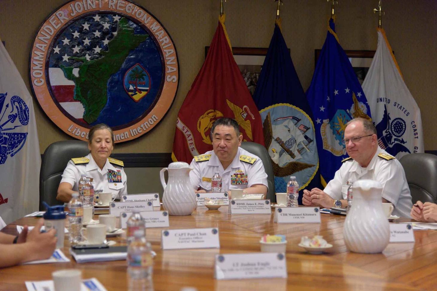 ASAN, Guam (April 8, 2019) — Rear Adm. Shoshana Chatfield, commander, Joint Region Marianas, left; Vice Admiral. Tatsuhiko Takashima, Japan Maritime Self-Defense Force Fleet Submarine Force commander, center; and Rear Adm. Jimmy Pitts, Commander, Submarine Group 7 meet at the JRM Headquarters in Asan April 8. During his visit to Guam, Takashima viewed ships, facilities and sites on island including ship repair, quality-of-life facilities for submariners and partnership opportunities in the region.