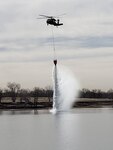 A Colorado National Guard Black Hawk crew uses a water bucket to help partner agencies fight fires near Las Animas, Colorado. The blaze began in a riverbed near the Bent County Correctional Facility in a rural area east of Las Animas.