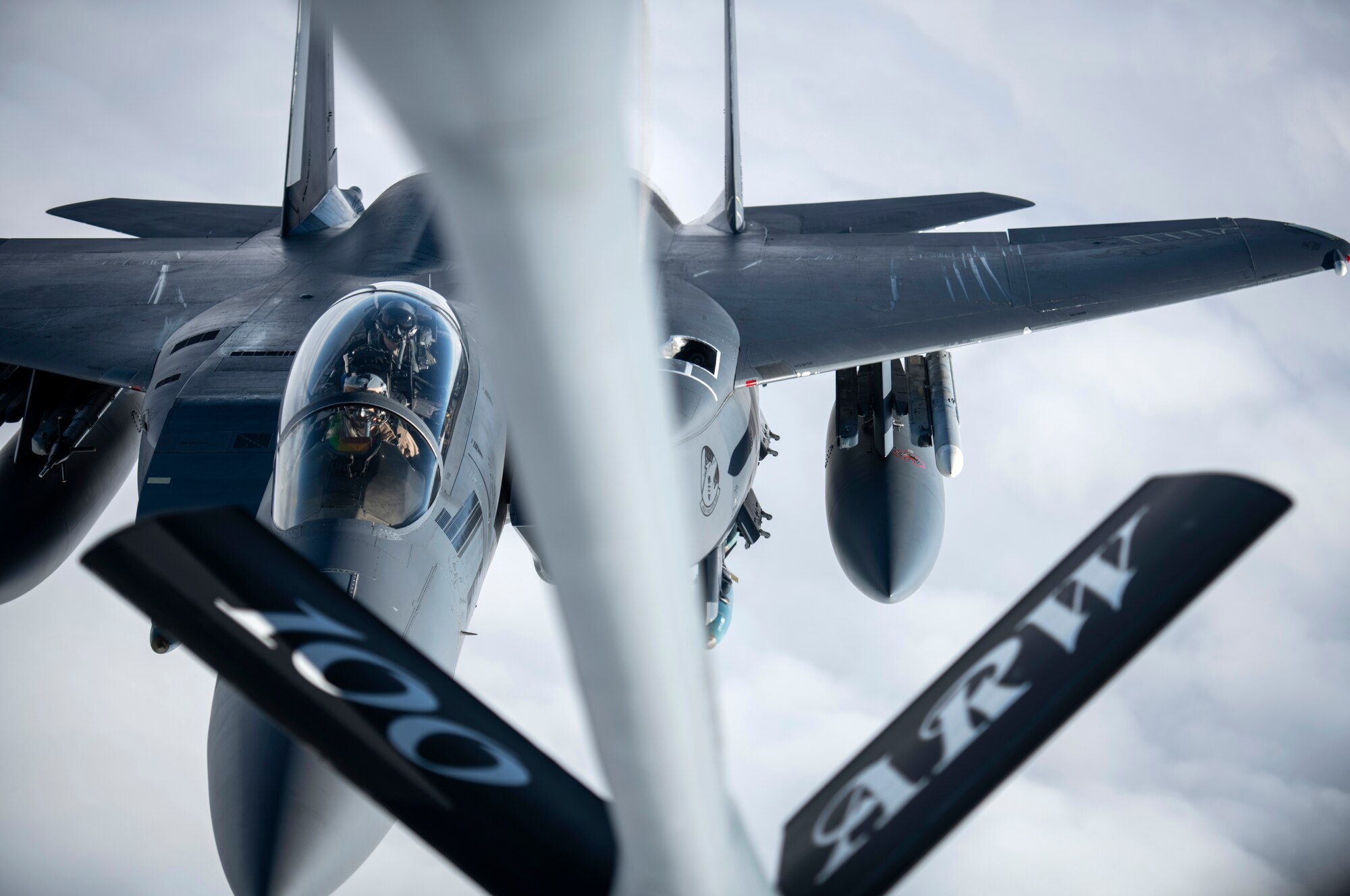 A U.S. Air Force F-15E Strike Eagle assigned to the 492nd Fighter Squadron at RAF Lakenheath, England, approaches a KC-135 Stratotanker from the 100th Air Refueling Wing, RAF Mildenhall, England, to receive fuel over Scotland during exercise Joint Warrior 19-1, April 4, 2019. Joint Warrior is hosted by the U.K. biannually and aims to allow NATO forces to conduct joint operations in a complex environment, involving different military branches and units from different countries against a range of current and future threats.  (U.S. Air Force photo by Tech. Sgt. Emerson Nuñez)