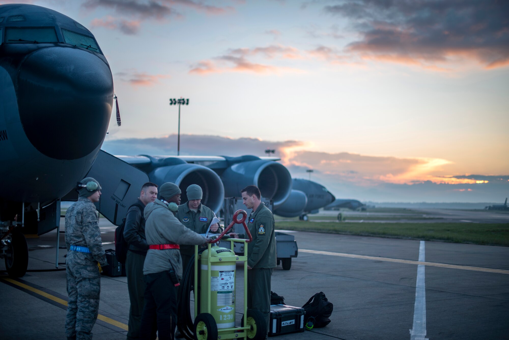 U.S. Air Force aircrew from the 351st Air Refueling Squadron and crew chiefs from the 100th Aircraft Maintenance Squadron review a pre-flight checklist together prior to a flight supporting exercise Joint Warrior 19-1 at RAF Mildenhall, England, April 4, 2019. Joint Warrior is a U.K.-led multinational exercise that involves numerous warships, aircraft, marines and troops. (U.S. Air Force photo by Tech. Sgt. Emerson Nuñez)
