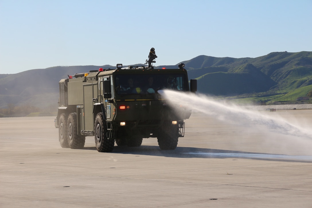 Aircraft Rescue and Fire Fighting Marines spray water from the bumper turret on the P-19R during an exercise aboard Marine Corps Air Station Camp Pendleton, Calif, in February 2019. Program Executive Officer Land Systems is currently fielding the P-19R to Marines worldwide. (U.S. Marine Corps photo by Ashley Calingo)