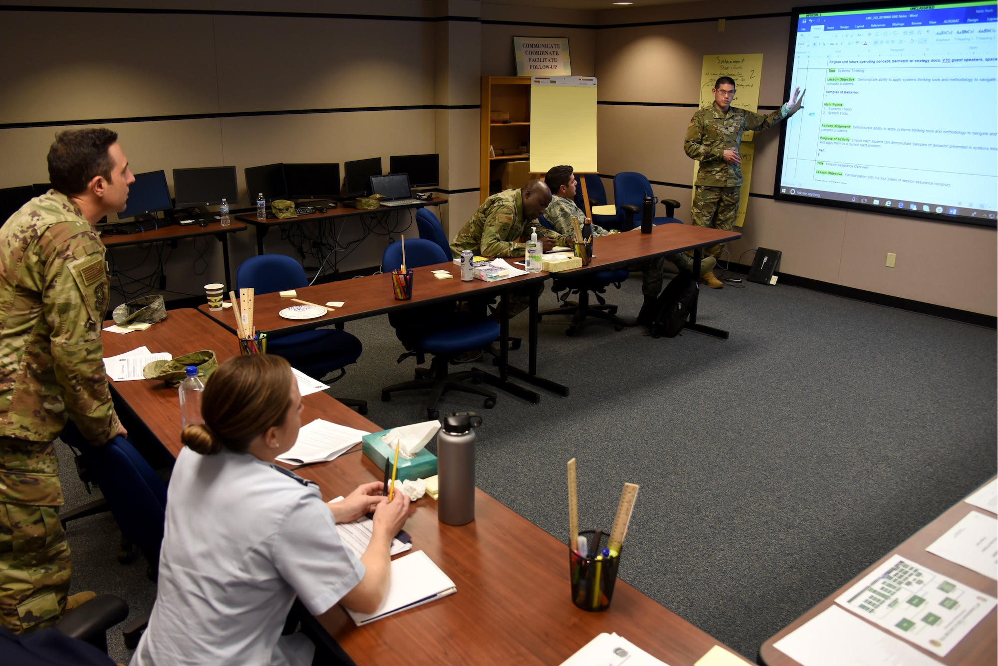 U.S. Air Force Lt. Col. Jason Okumura, chief of strategic communications assigned to the Joint Staff, briefs his team mates on lesson plan content at the U.S. Air Force Expeditionary Operations School (EOS), part of the U.S. Air Force Expeditionary Center, at Joint Base McGuire-Dix-Lakehurst, New Jersey, April 4, 2019.