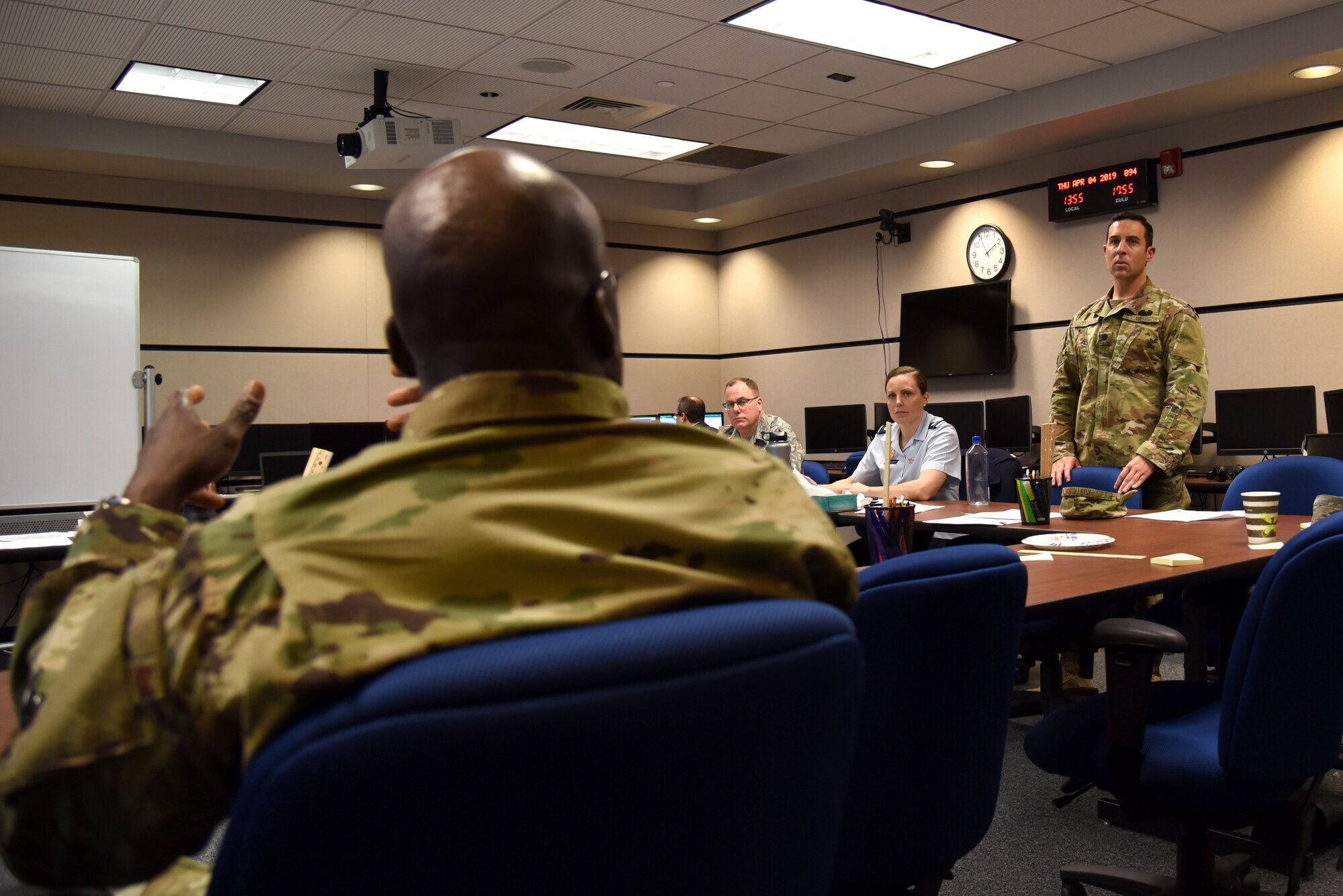 U.S. Air Force Lt. Col. Ola Ekundayo, mission assurance branch chief assigned to the Joint Staff, shares his ideas about lesson plan content with his team mates at the U.S. Air Force Expeditionary Operations School (EOS), part of the U.S. Air Force Expeditionary Center, at Joint Base McGuire-Dix-Lakehurst, New Jersey, April 4, 2019.