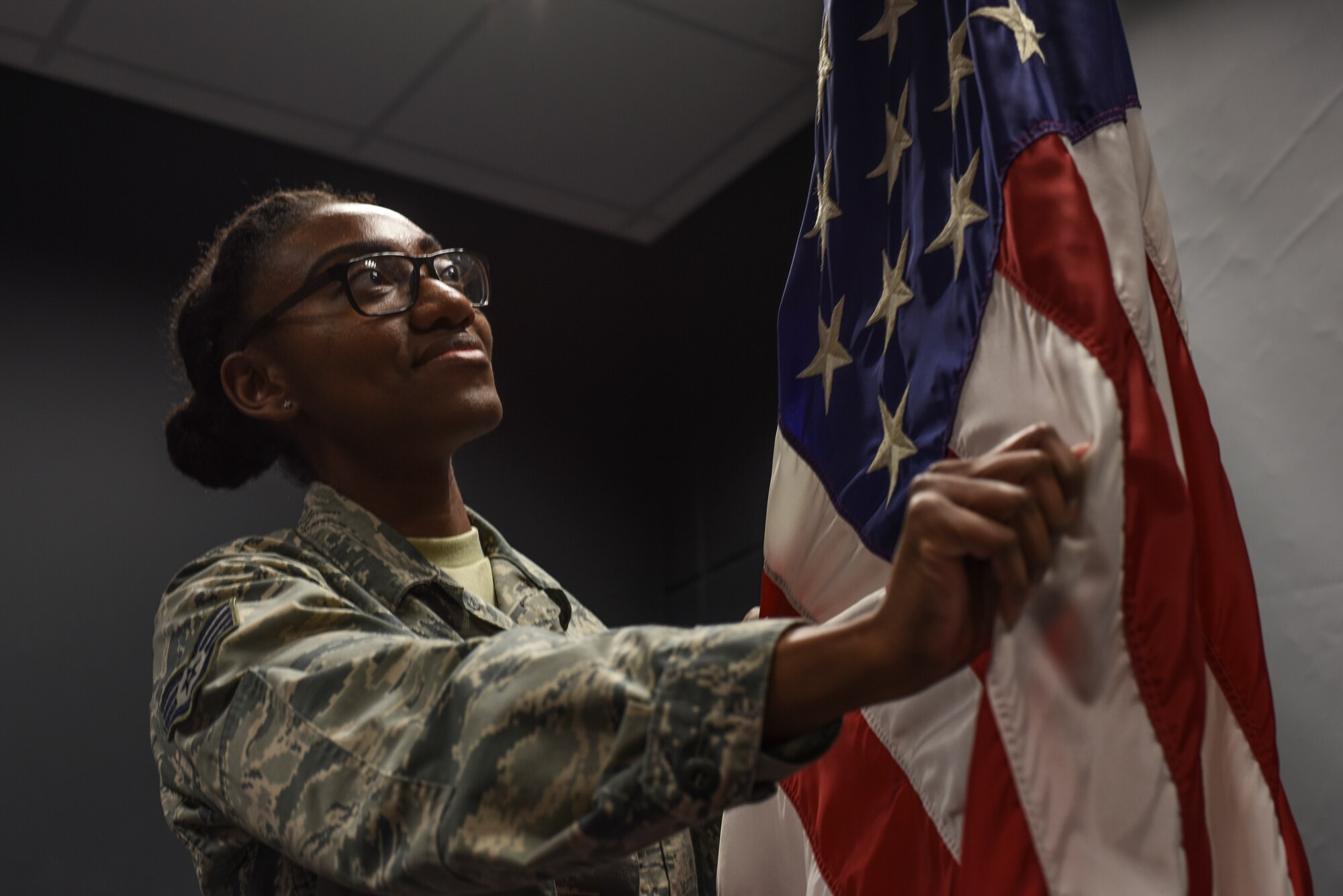 Staff Sgt. Ebony Rivera, 39th Air Base Wing protocol NCO in charge, demonstrates how to properly prepare the U.S. flag March 14, 2019, at Incirlik Air Base, Turkey.
