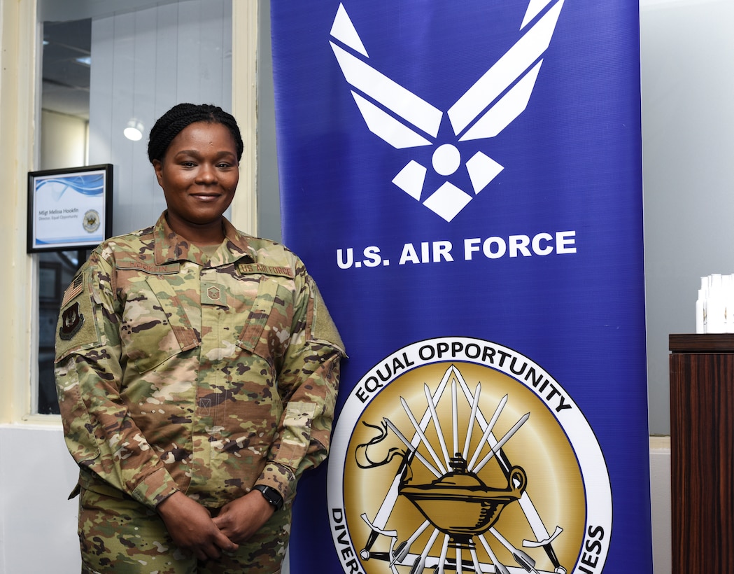 Master Sgt. Melissa Hookfin, 39th Air Base Wing equal opportunity director, stands next to the equal opportunity banner outside her office March 18, 2019, at Incirlik Air Base, Turkey.