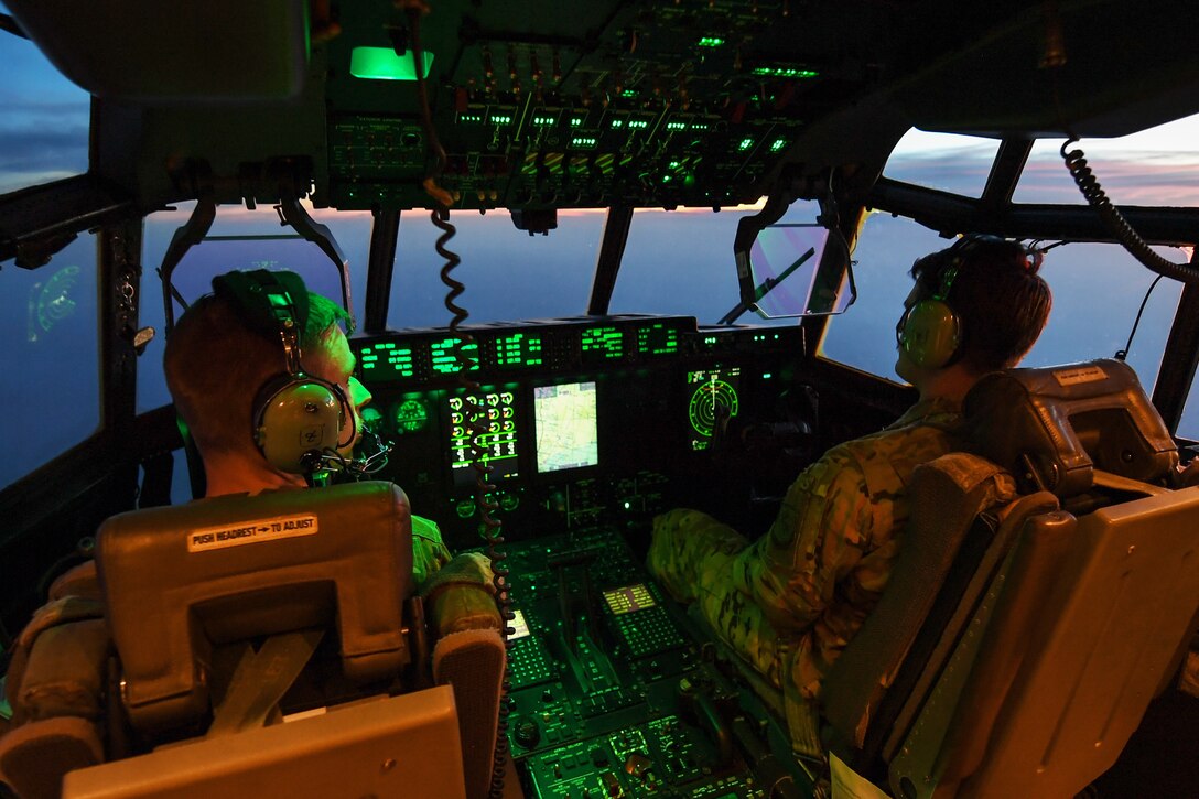 Airmen fly an aircraft.