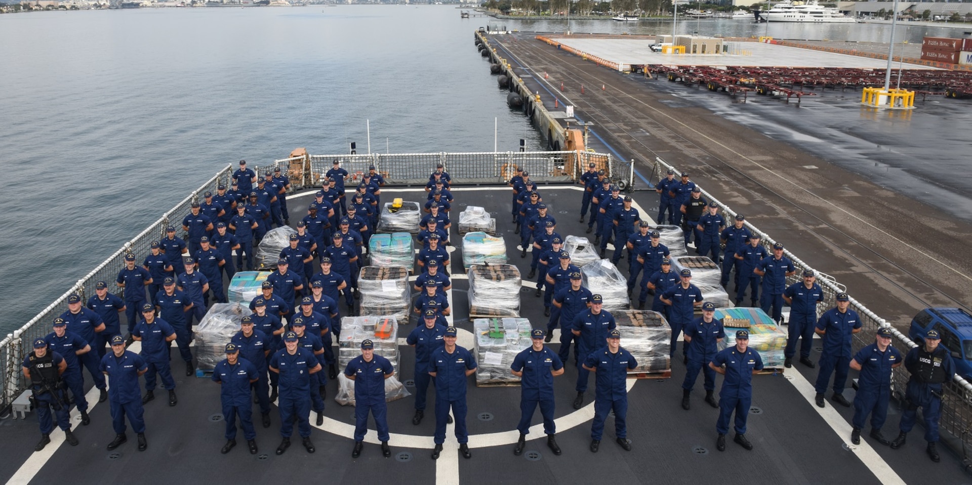The crew of the Coast Guard Cutter Waesche poses with pallets holding more than 7.1 tons of contraband Friday at Tenth Avenue Marine Terminal in San Diego April 5, 2019.