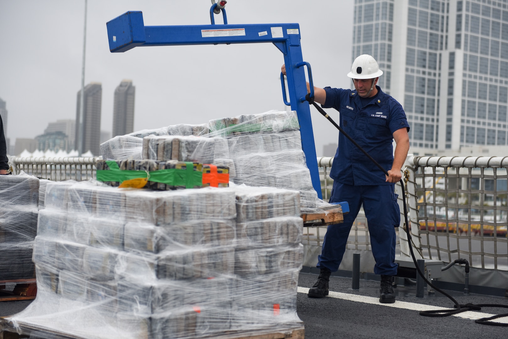 A Coastguardsman offloads contraband from the cutter at Tenth Avenue Marine Terminal in San Diego April 5, 2019.