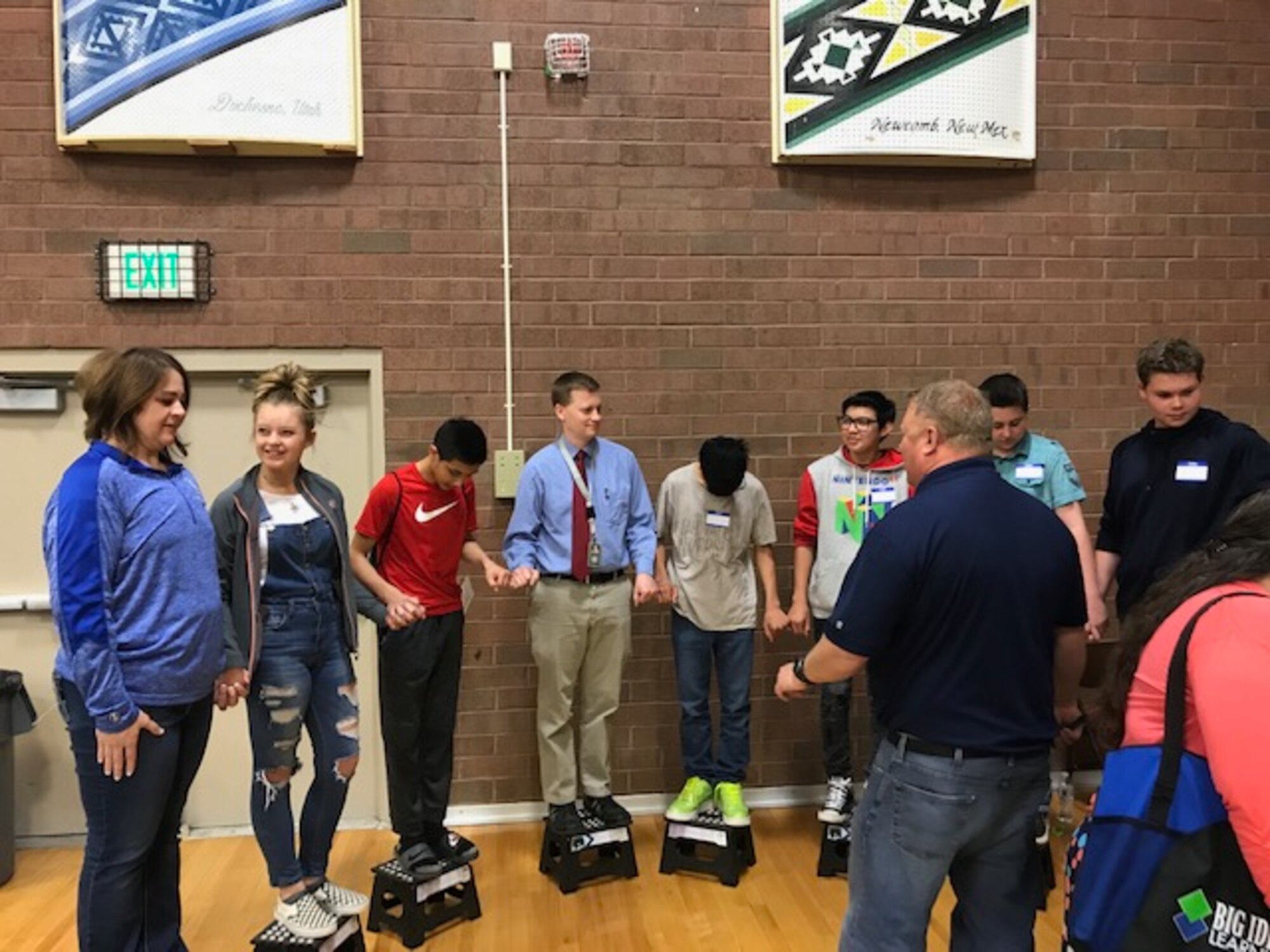 Hill Air Force Base electrical engineer Sebron Farmer conducts an electricity demonstration with students at Monument Valley High School in Kayenta, Utah, during the San Juan Career Fair March 27, 2019. Hill AFB computer scientists and engineers presented the electricity demonstration, taught some basic coding skills and encouraged students to focus on STEM-related subjects, giving them an idea of the important work they could do if they chose an Air Force career. (Courtesy photo)