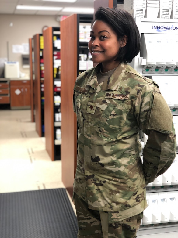 Maj. Amanda Ferguson, 628th Medical Group Pharmacy Flight commander, pauses in the newly renovated pharmacy facilities. Her vision of a remodel was recently completed, the goal of which is to make their patients' experiences better, faster and easier than in the past.