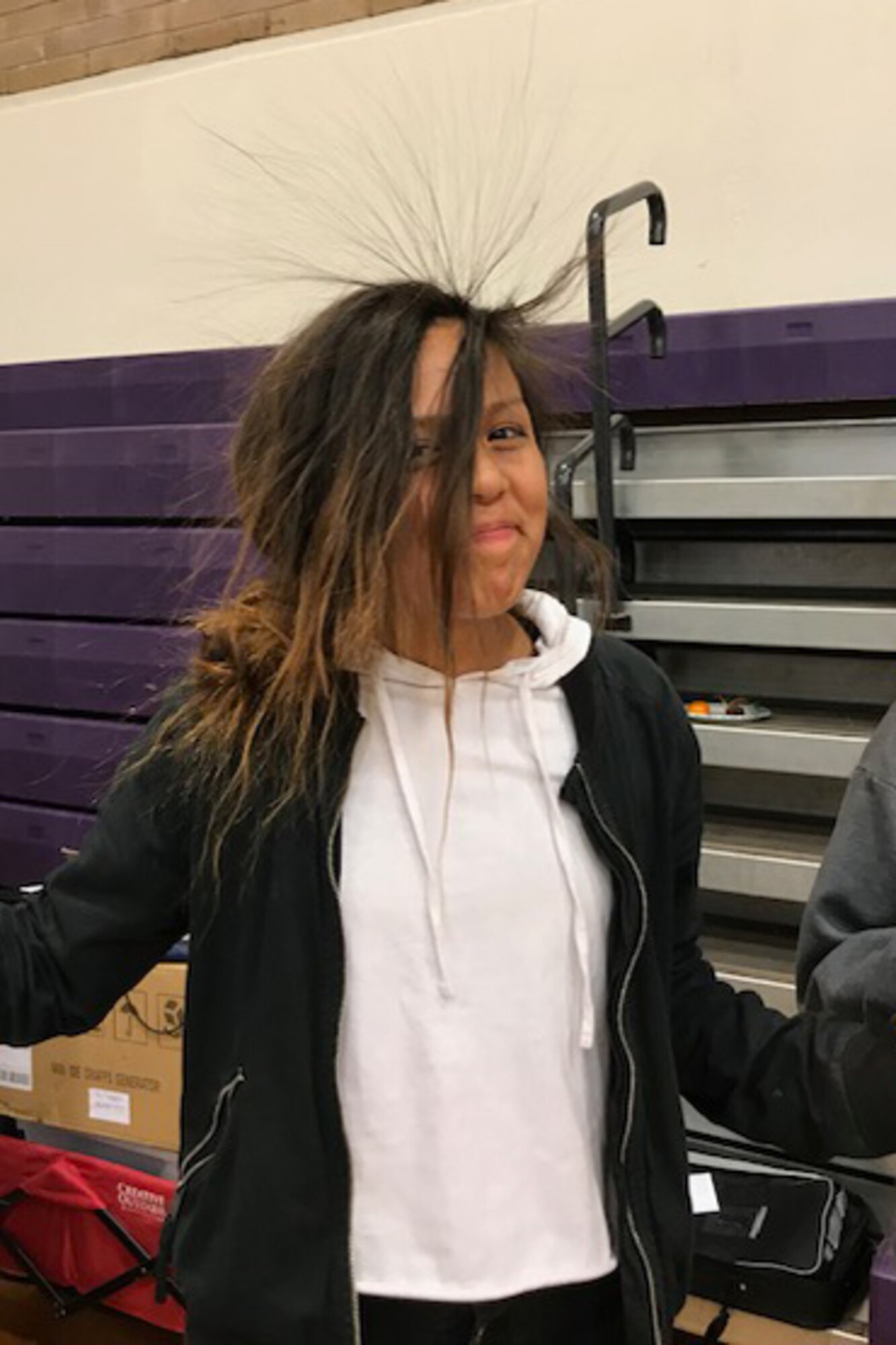 A student participates in an electricity demonstration at Monument Valley High School in Kayenta, Utah, during the San Juan Career Fair March 27, 2019. Hill Air Force Base computer scientists and engineers presented the electricity demonstration, taught some basic coding skills and encouraged students to focus on STEM-related subjects, giving them an idea of the important work they could do if they chose an Air Force career. (Courtesy photo)