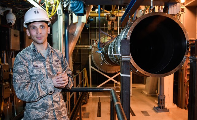 While standing in the Sea Level 2 test cell at Arnold Air Force Base, Capt. Jonathon Dias, test manager with the Aeropropulsion Combined Test Force at Arnold Air Force Base, speaks about the test capabilities of the cell. (U.S. Air Force photo by Jill Pickett)