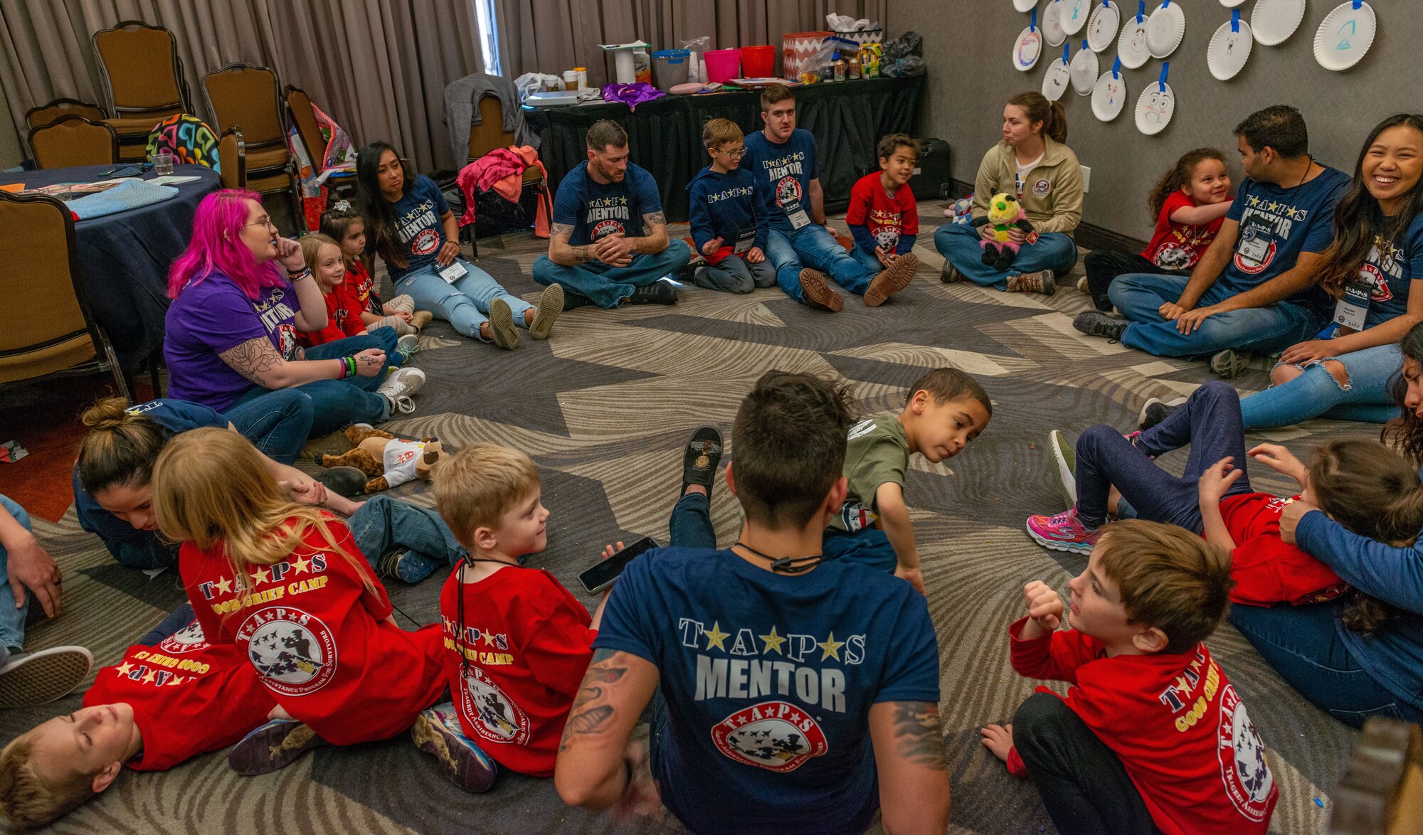 Tragedy Assistance Program for Survivors mentors and children engage each other during a bonding session at the TAPS mountain state regional military survivor seminar, Colorado Springs, Colorado, April 2, 2019. TAPS provides comfort and hope through peer support networks and connecting the bereaved to grief resources such as Good Grief Camps at no cost to the family of the fallen. Since 1994, TAPS has assisted more than 85,000 surviving families, casualty officers and caregivers. (U.S. Air Force courtesy photo)