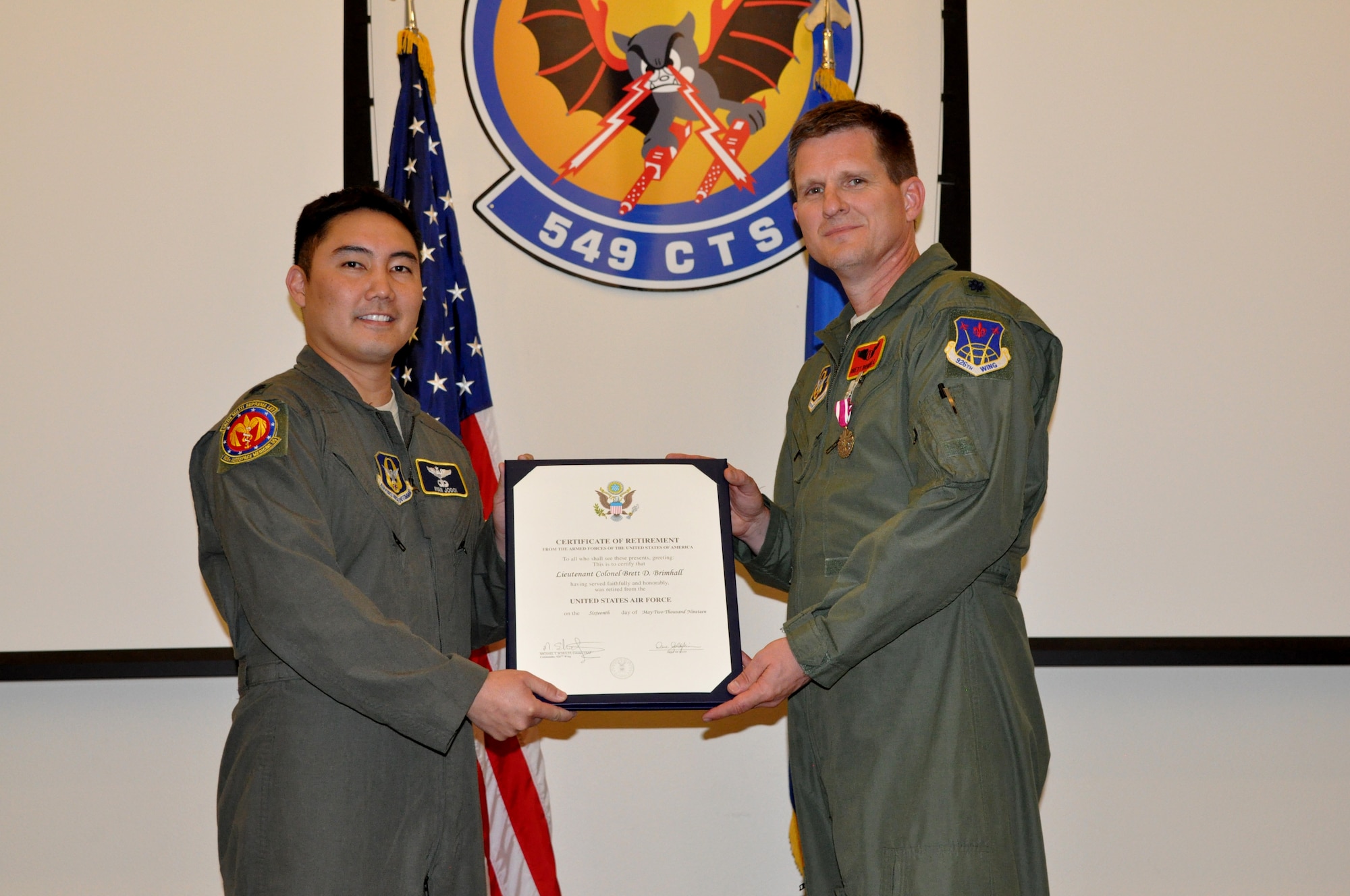 Lt. Col. Brett Brimhall, a 926th Aerospace Medicine Squadron flight surgeon and chief of medical staff, retires in a ceremony on Nellis Air Force Base, Nev., on April 7, 2019 after 24 years of military service.