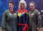 Lt. Col. Kari Hill (left), 433rd Operations Support Squadron commander/pilot, and Tech. Sgt. Debra Hill (right), 68th Airlift Squadron loadmaster, both with Joint Base San Antonio-Lackland, pose with Rebecca Sorenson, owner of Chic Basics, and a domestic engineer March 23 during the “Marvelous Women Don’t Need Capes” event at the Alamo Drafthouse movie cinema in San Antonio. The “Show them Everything Possible” Organization of San Antonio hosted the event.