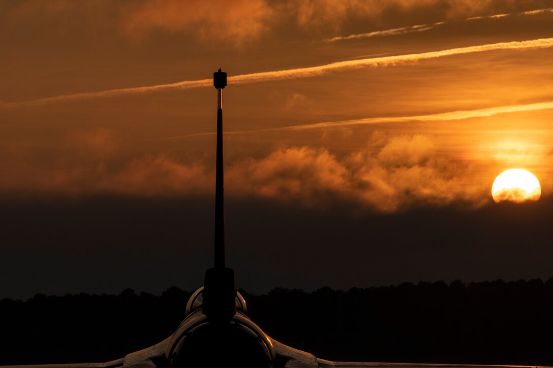 The sun rises over an Air Force base.