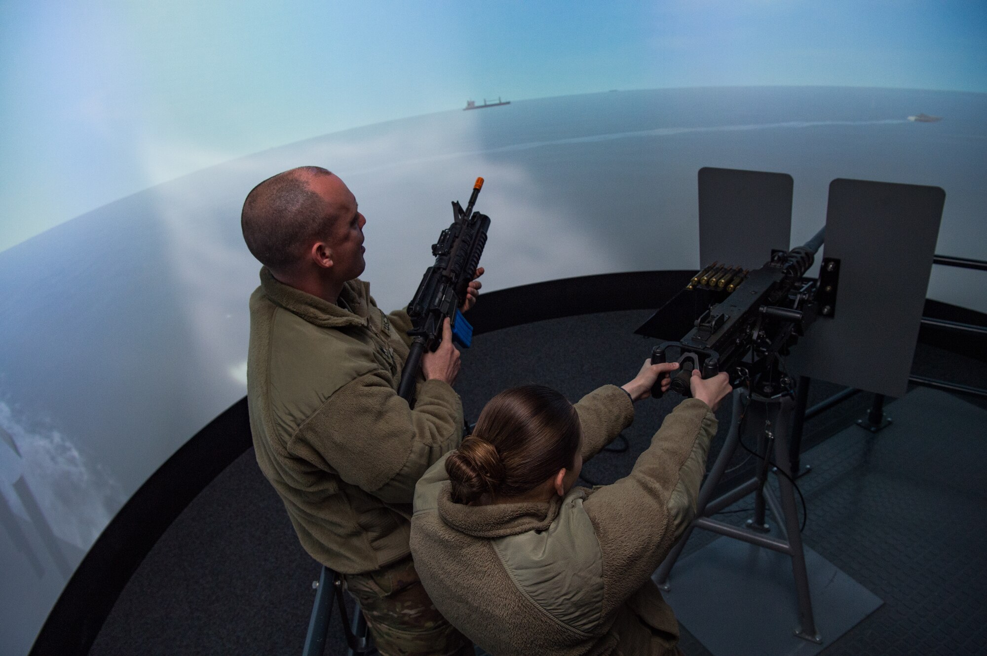From the left, U.S. Army Sgt. Jordan Snipes, and Sgt. Tiffany Bosley, 824th Transport Company (Heavy Boat), 143rd Sustainment Command-Expeditionary, 377th Theater Sustainment Command, Morehead, North Carolina, heavy boat operators, train on the Vessel Defense Simulator at the U.S. Army Transportation School, Maritime & Intermodal Training Department at Joint Base Langley-Eustis, Virginia, April 1, 2019.
