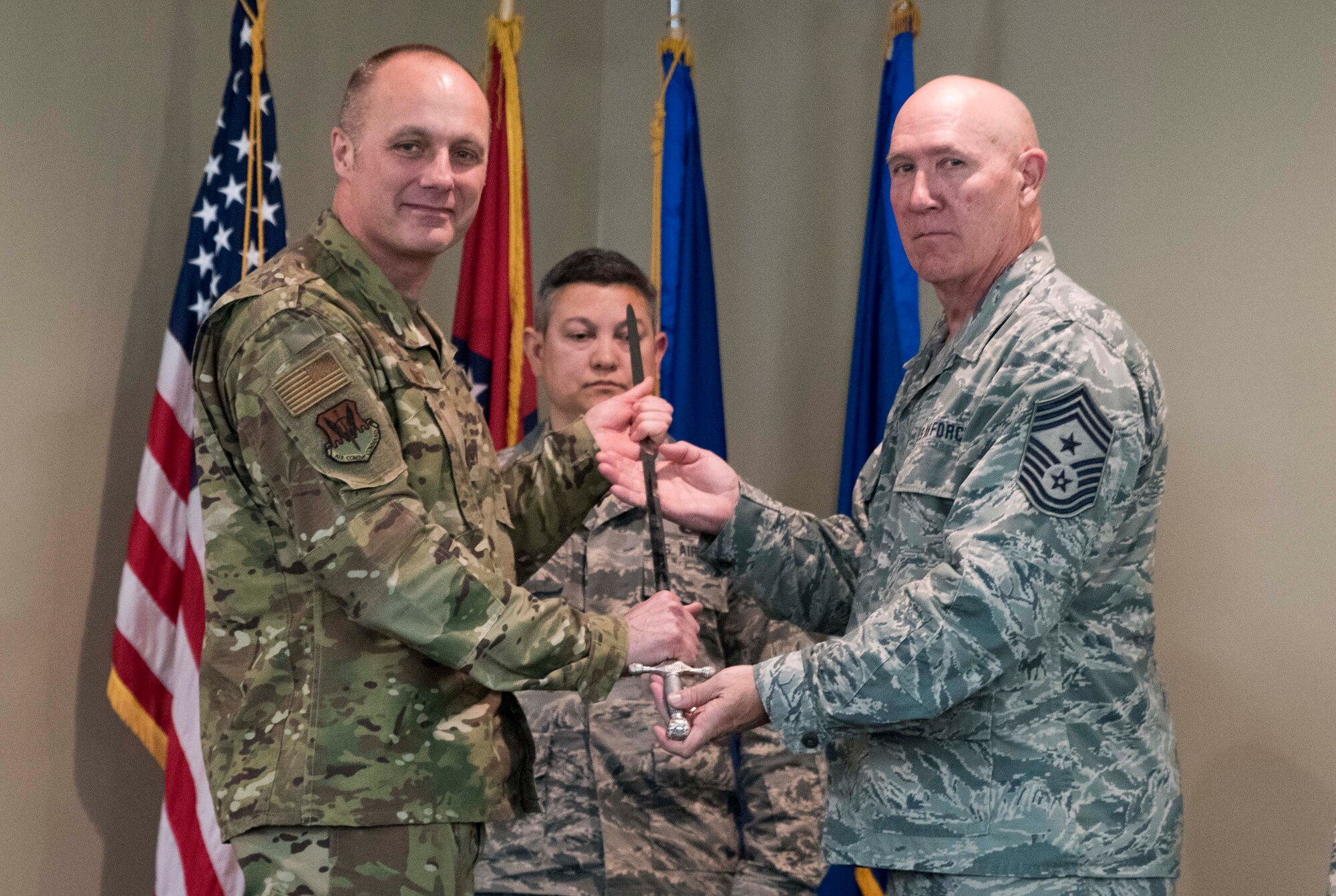 Chief Master Sgt. Stephen R. Bradley, former 188th Wing command chief master sergeant, relinquished responsibility as wing command chief to Col. Robert I. Kinney, 188th Wing commander, during a change of responsibility ceremony at Ebbing Air National Guard Base, Fort Smith, Ark., April. 7, 2019. Bradley served as the 188th Wing command chief for six years and passes the responsibility to Chief Master Sgt. Donald E. Frederick, 188th Wing command chief. (U.S. Air National Guard photo by Tech. Sgt. Daniel Condit)