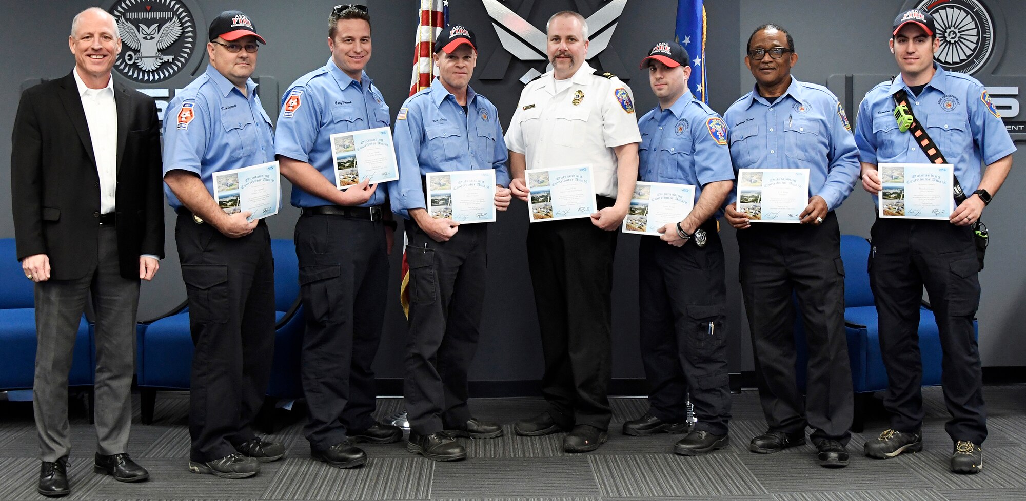 : Rich Tighe, left, general manager for the AEDC Test Operations and Sustainment contract, recognizes Arnold Air Force Base Fire and Emergency Services team members March 8 for their response to a recent sandblasting incident when a TOS team member sustained an injury. Tighe presented certificates thanking the team for their “responsiveness and decision-making” which “made a major difference in the life of one of our employees.” Also pictured from left, are Facility Support Services contract FE Services team members: Firefighter Crew Chief Kip Luttrell, Paramedic/Firefighter Cory Friend, Driver/Operator Ken Locker, Assistant Chief for Operations Gary Horn, Firefighter Justin Wiser, Firefighter T.A. King, Driver/Operator Brandon Gunn, and not pictured Driver/Operator Roger Whitton, Paramedic/Firefighter Brian Taylor and Driver/Operator Lonnie Brown. (U.S. Air Force photo by Jill Pickett)