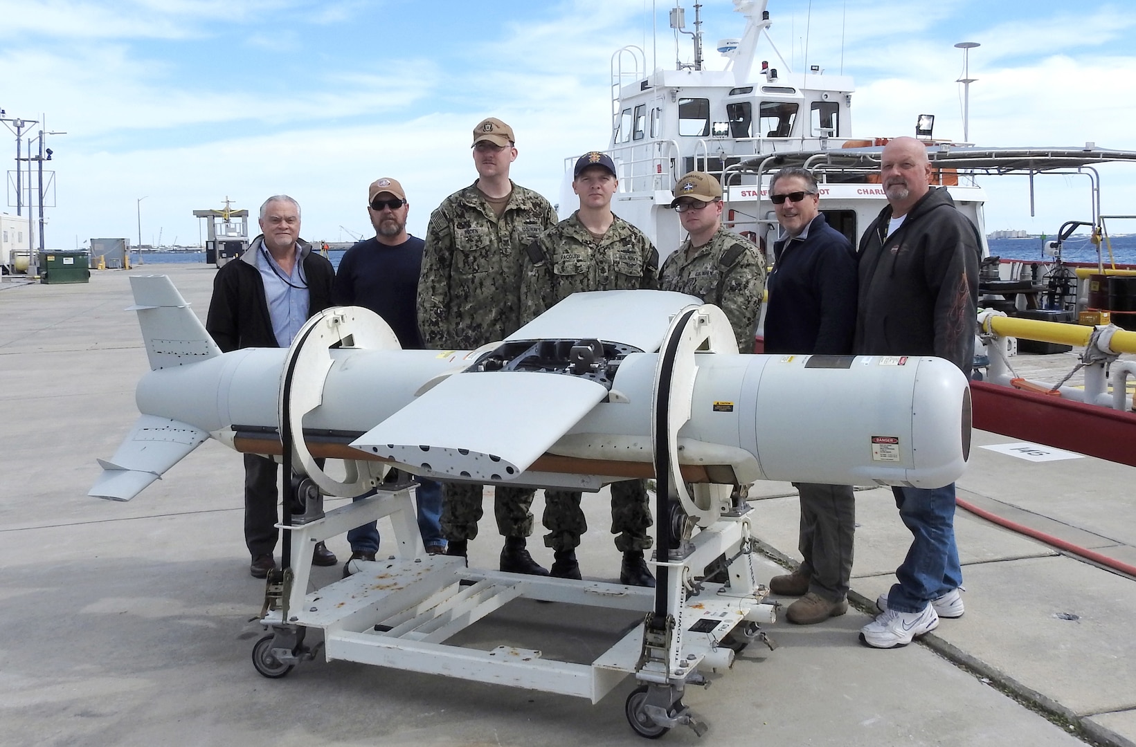 The AN/AQS-20C (Q-20C) Sonar Sensor Post Mission Analysis (PMA) Operators gather pier side March 15, 2019 with the Naval Surface Warfare Center Panama City Division (NSWC PCD) Q-20C project team’s subject matter experts.