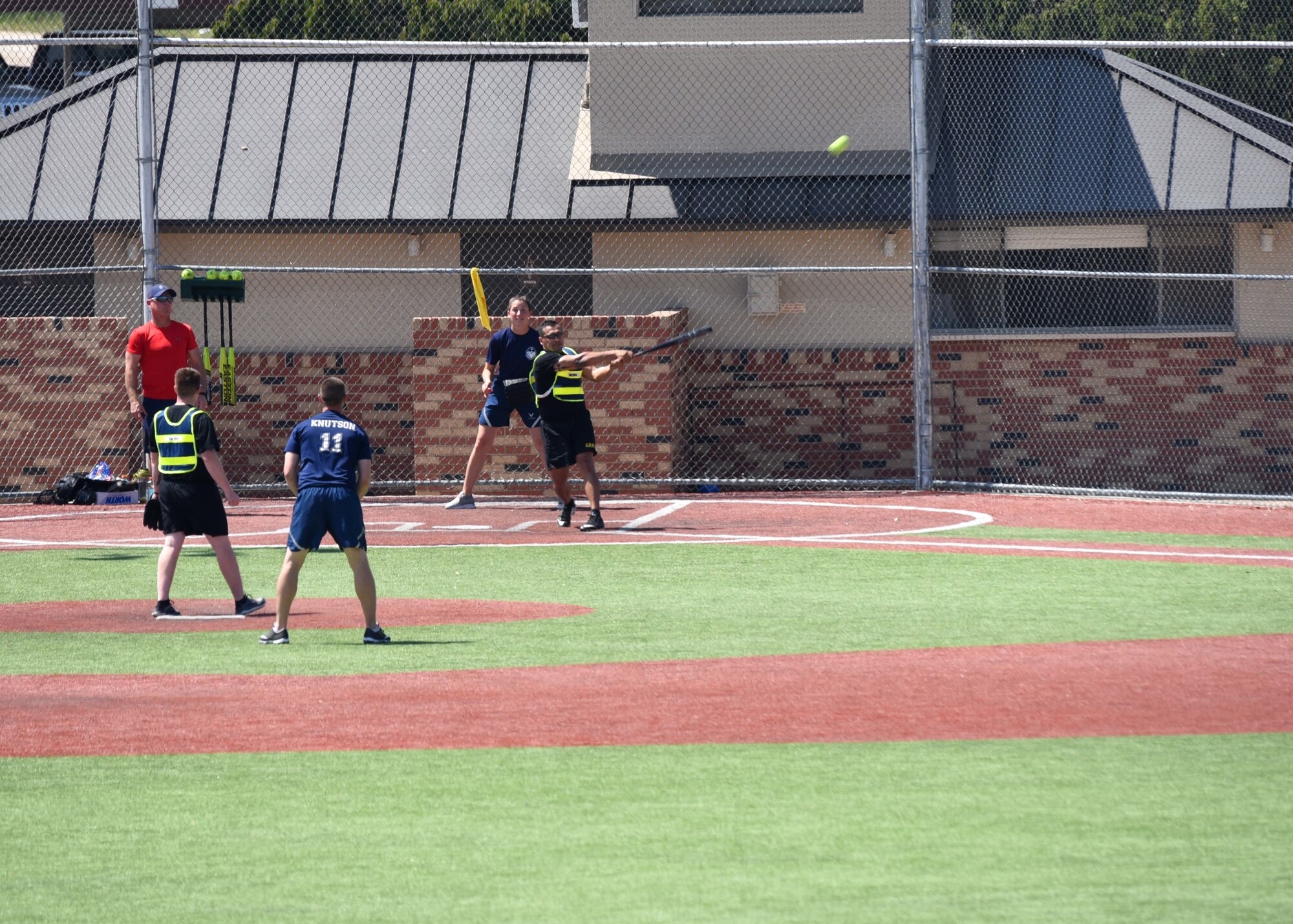 Participants play softball, which was just one activity available during Sports Day at the Mathis Fitness Center, Goodfellow Air Force Base, Texas, April 5, 2019. Teams could also play volleyball, kickball and Ultimate Frisbee. (U.S. Air Force photo by Airman 1st Class Zachary Chapman/released)