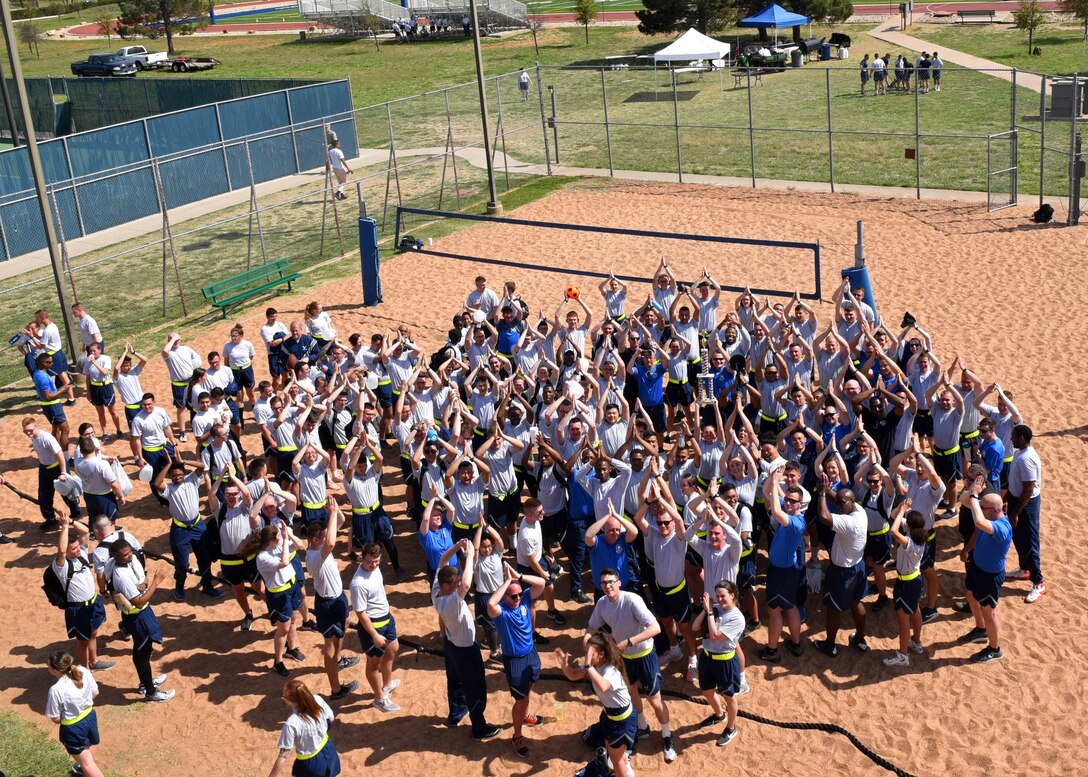 Members from the 316th Training Squadron pose for a photo after winning Sports Day held at the Mathis Fitness Center, Goodfellow Air Force Base, Texas, April 5, 2019. The 316th TRS dethroned the 315th Training Squadron who had taken first for the last two Sports Days. (U.S. Air Force photo by Airman 1st Class Zachary Chapman/Released)