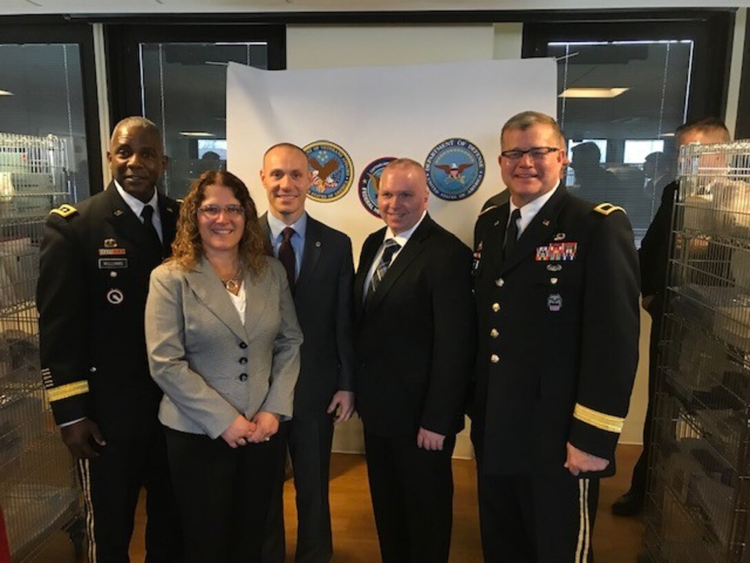 Leadership from DLA and the Department of Veterans Affairs pose after a ribbon cutting at the Captain James A. Lovell Federal Health Care Center March 7, 2019.