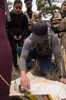 U.S. AIR FORCE ACADEMY, Colo. – Christian Schulte, a 302nd Airlift Wing Development and Training Flight trainee, finds his team’s location on the map to determine how to get back to the starting point of the day during a field training day, April 6, 2019, at the U.S. Air Force Academy, Colorado. Finding the way back to the starting point was the last exercise where the trainees had to use their new navigation skills taught by Master Sgt. Nathan Martinez, a 302nd Operations Support Squadron Survival, Evasion, Resistance and Escape specialist. (U.S. Air Force photo by Staff Sgt. Tiffany Lundberg)